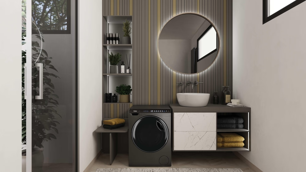 Modernes Badezimmer mit Waschmaschine, Waschbecken und Spiegel.