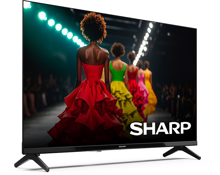 Egy TV színes ruhás modelleket mutat be kifutón. SHARP logó.