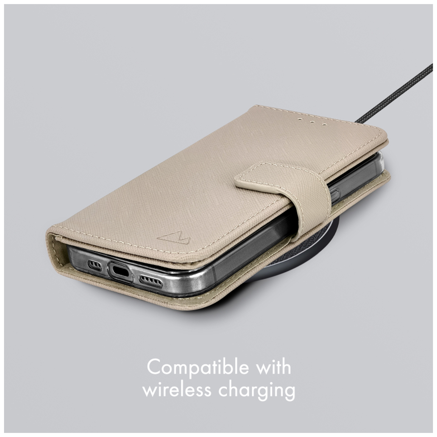 Beige phone case on a wireless charging pad.