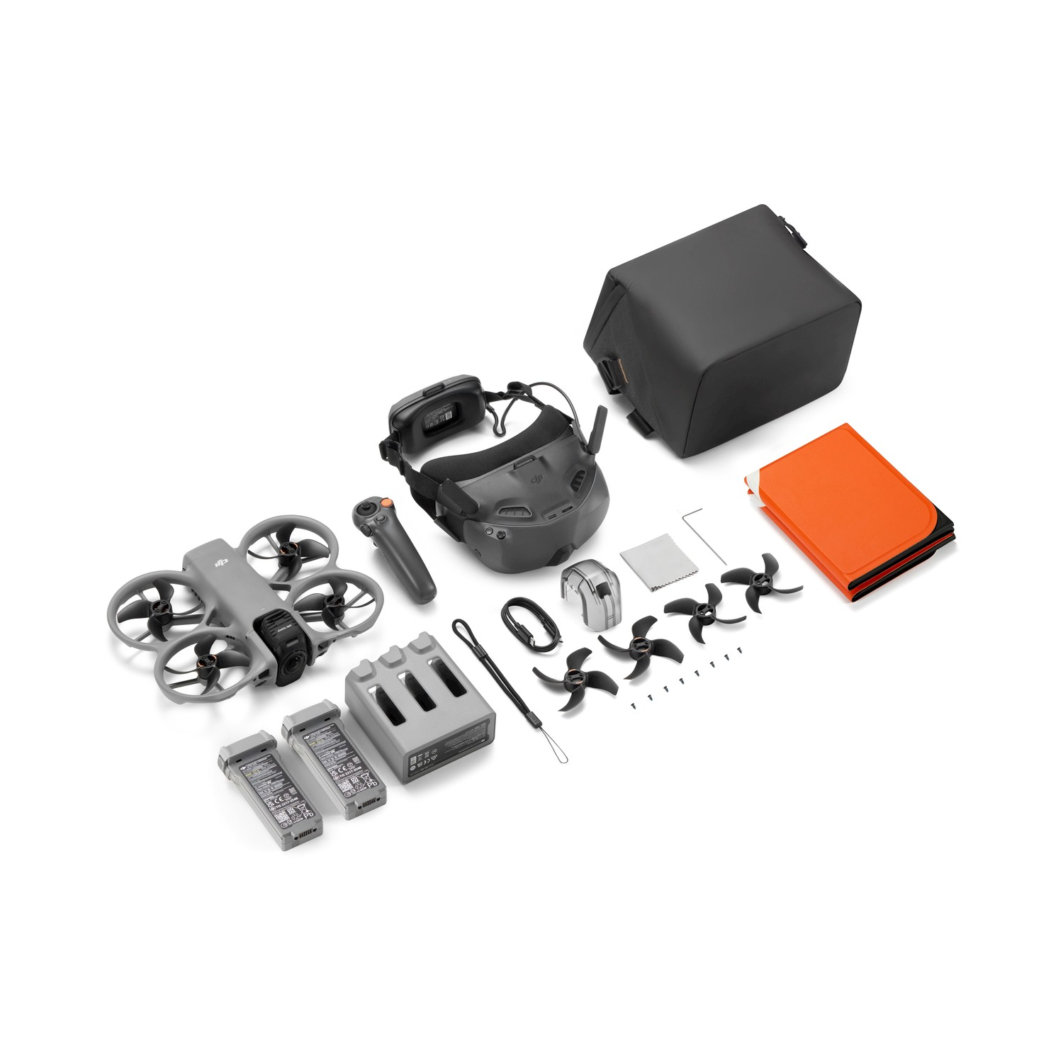 Drone grigio, occhiali, controller, batterie, caricabatterie, borsa, eliche e custodia arancione.