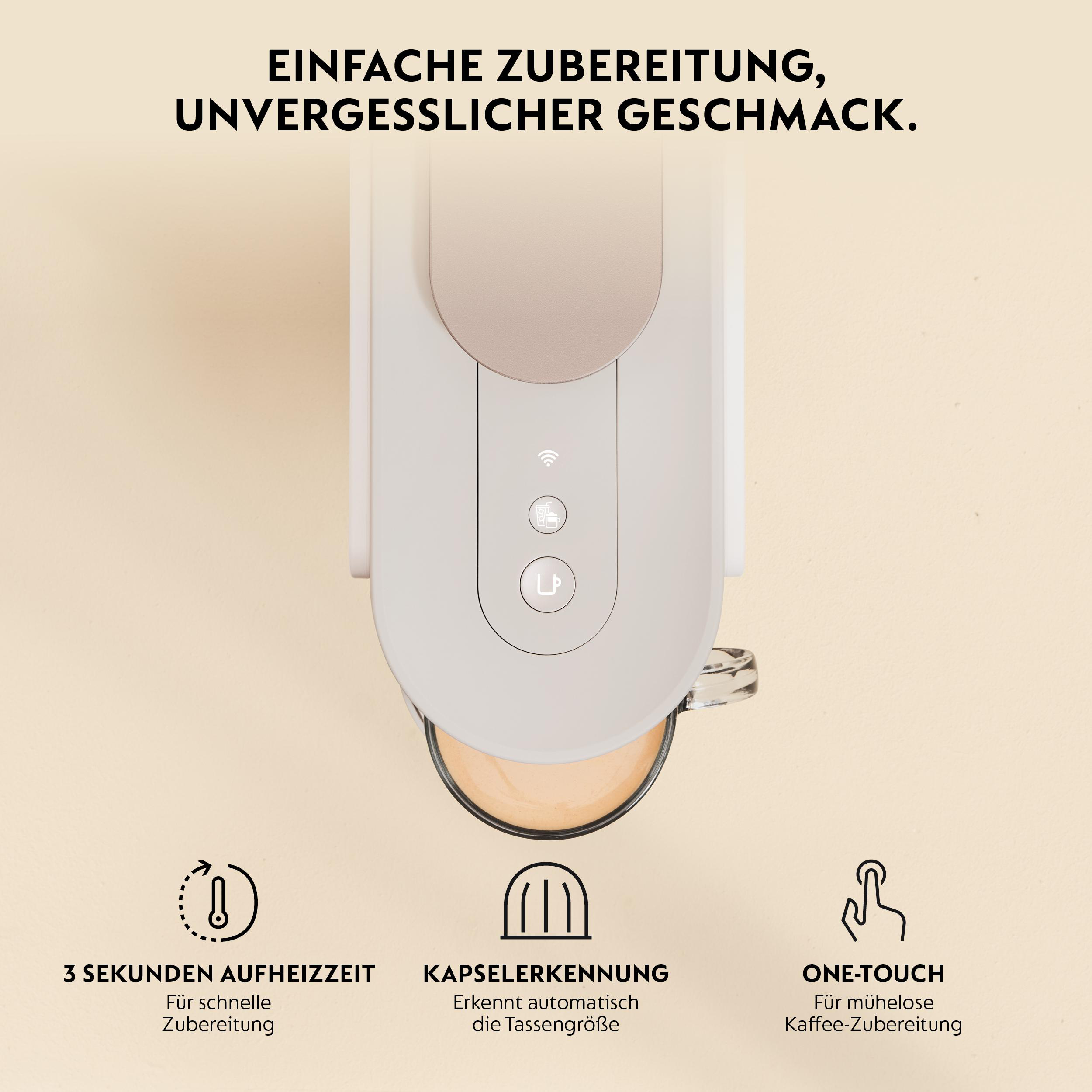 Eine weiße Kaffeemaschine mit einem Glas und Kaffee darin.