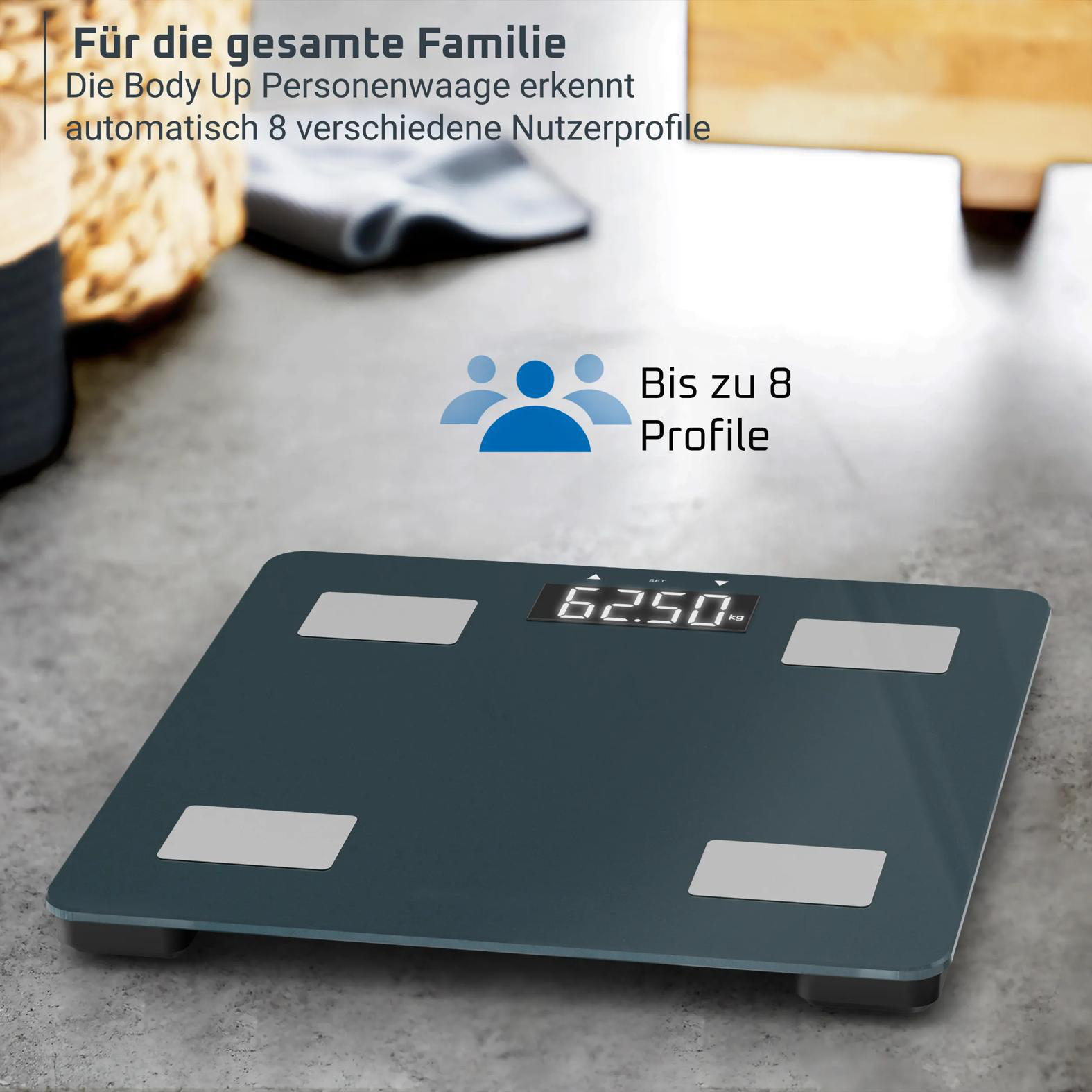 Dunkelgraue Personenwaage mit Display, zeigt 62.50 kg an. Bis zu 8 Profile.