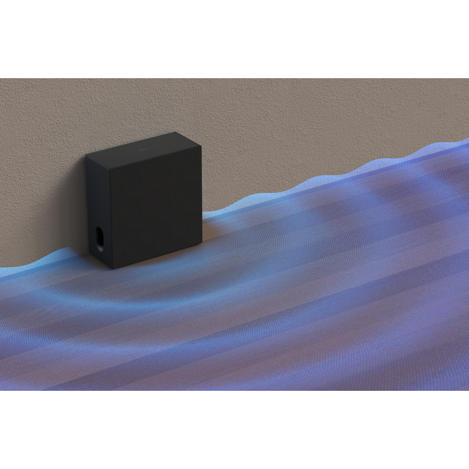 A black subwoofer sits against a textured wall, with blue wave patterns in front.
