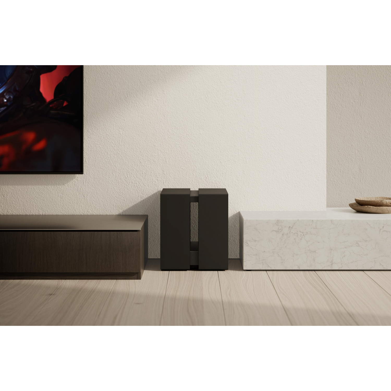 A dark wood cabinet, black cube, and marble block on a wood floor.
