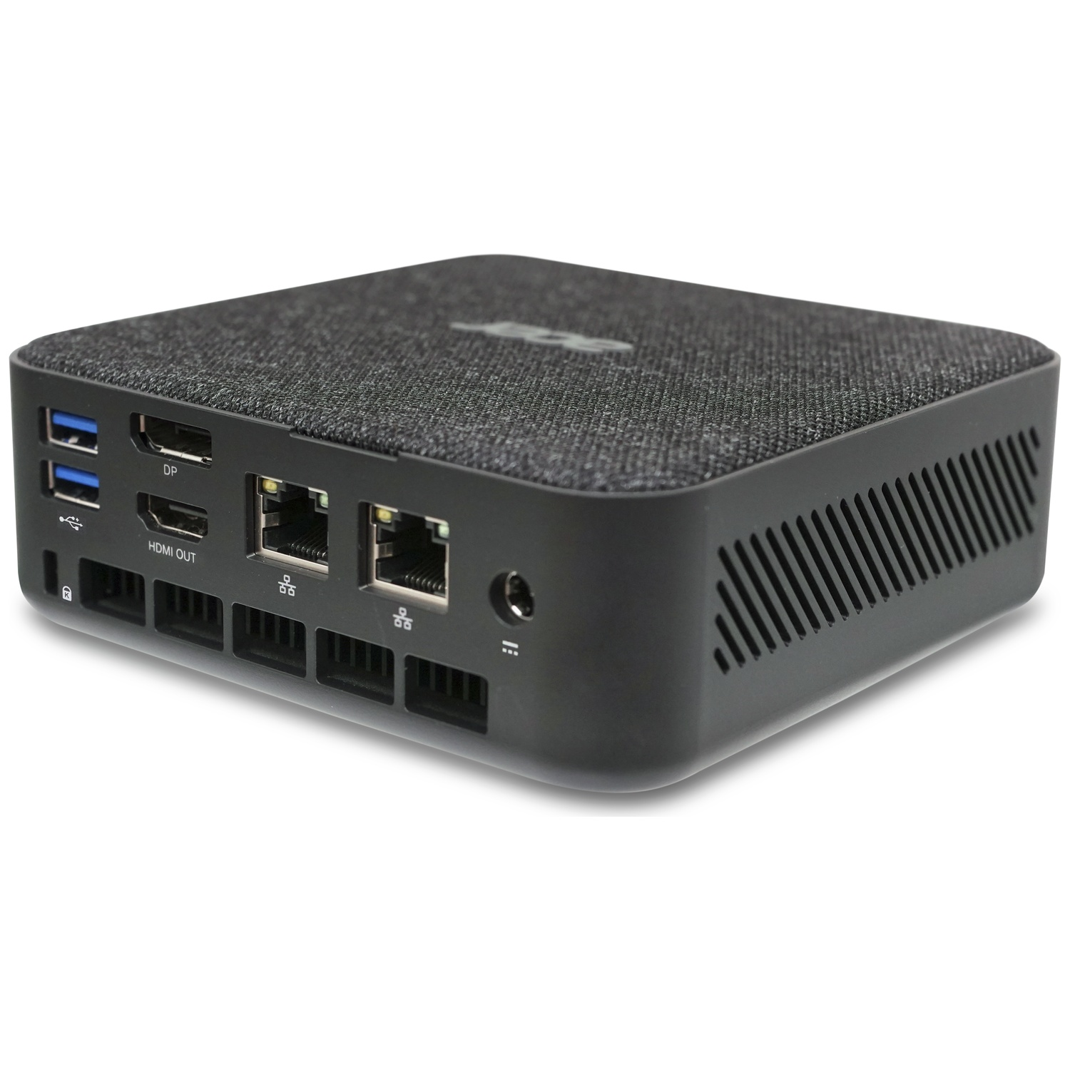 A compact black mini PC with a fabric top and ports on the side.
