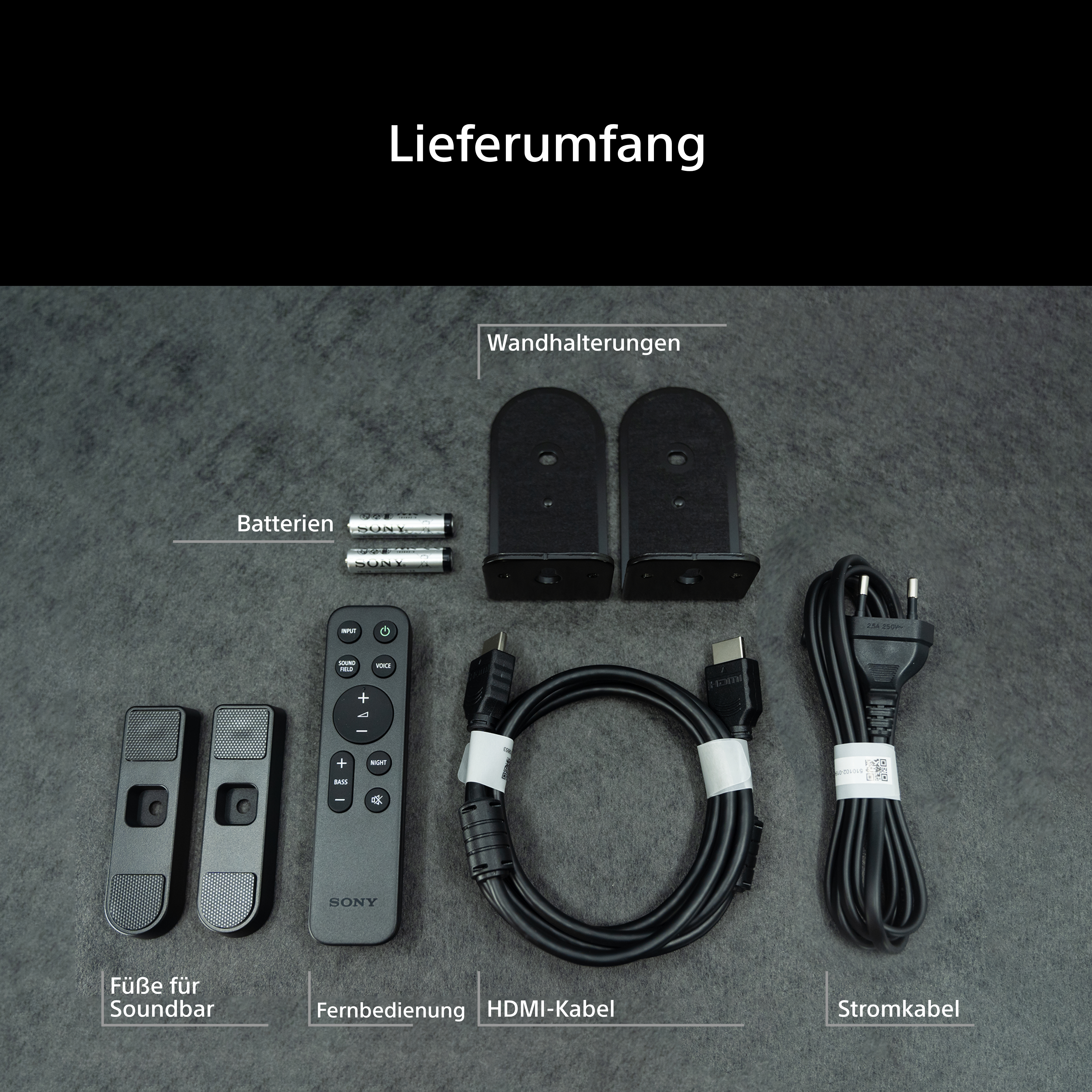 Die Lieferung enthält Füße, Batterien, Fernbedienung, Wandhalterungen, HDMI- und Stromkabel.