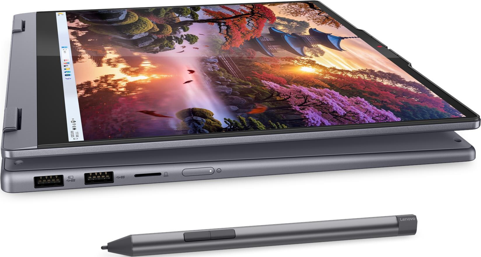 Ein graues Lenovo-Laptop ist geöffnet und zeigt eine lebendige Landschaftstapete. Ein Stift liegt unten.