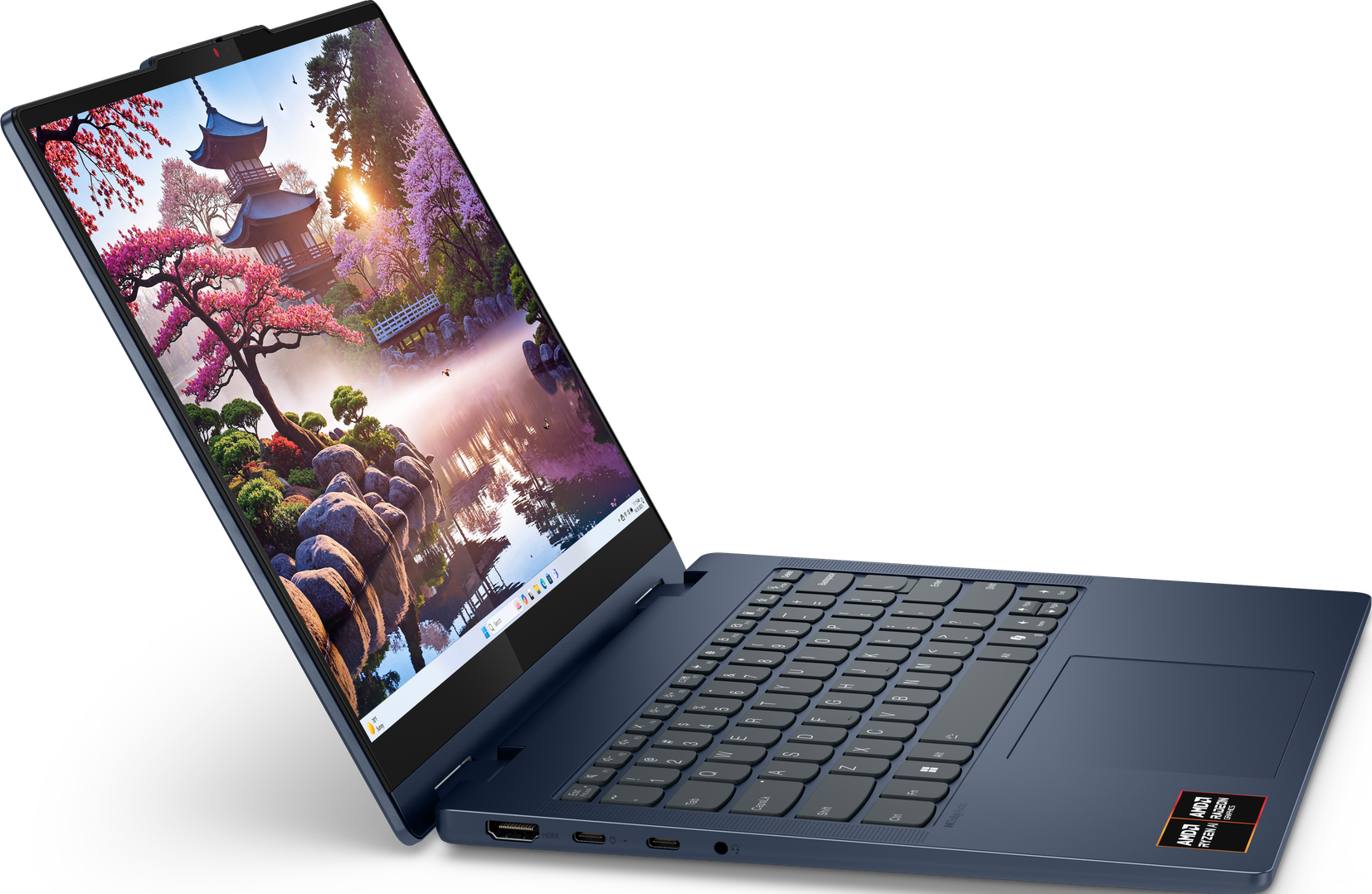 Ein geöffneter blauer Laptop mit japanischer Landschaft auf dem Bildschirm.
