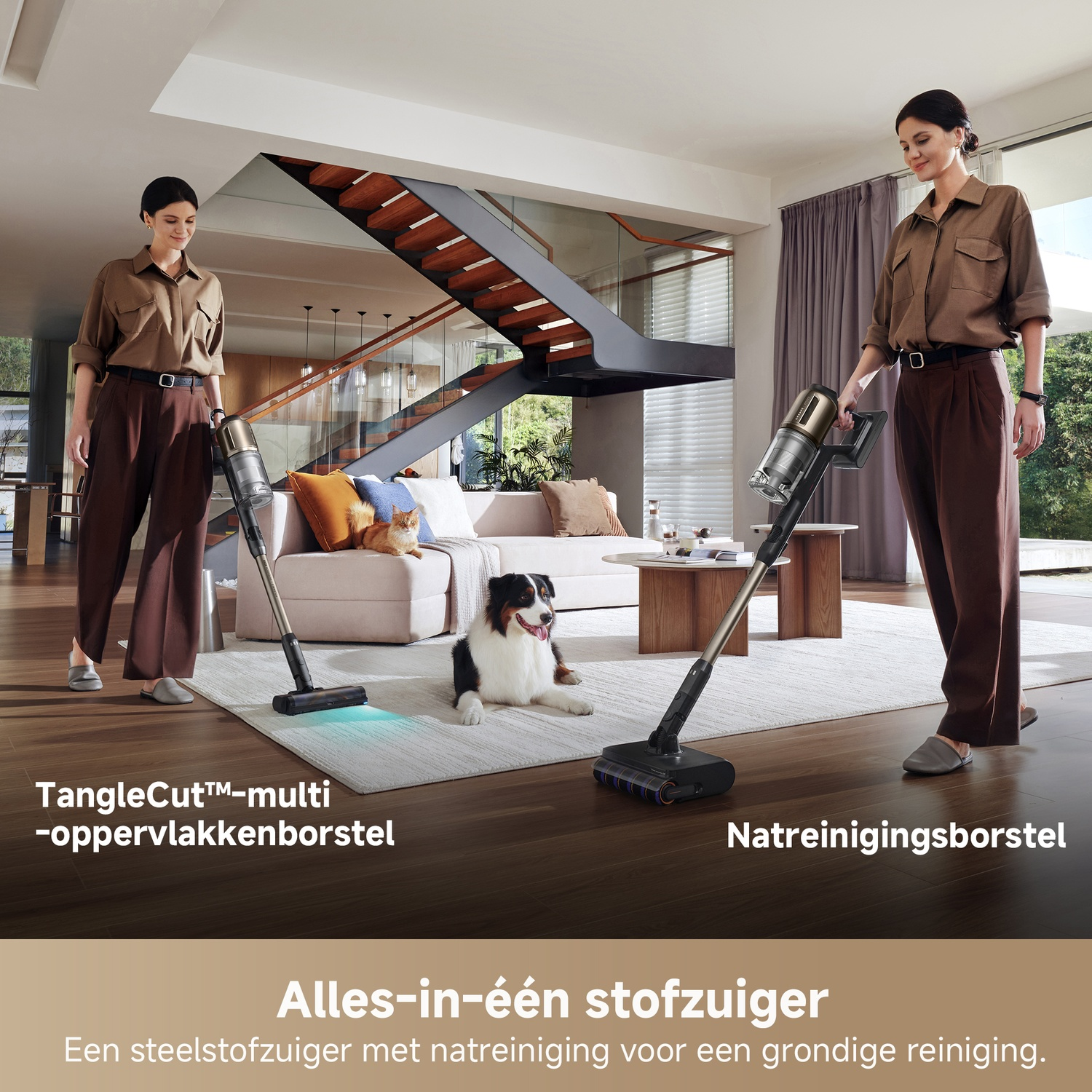 Two women operate vacuums in a modern living room with a dog and cat.