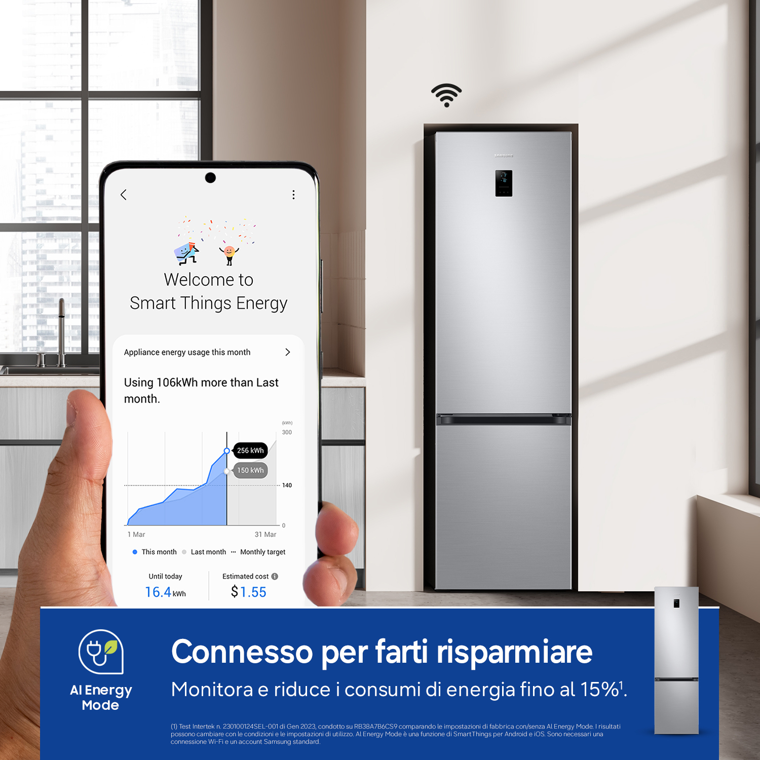Uno smartphone mostra l'app Smart Things Energy con dati di consumo accanto a un frigorifero.