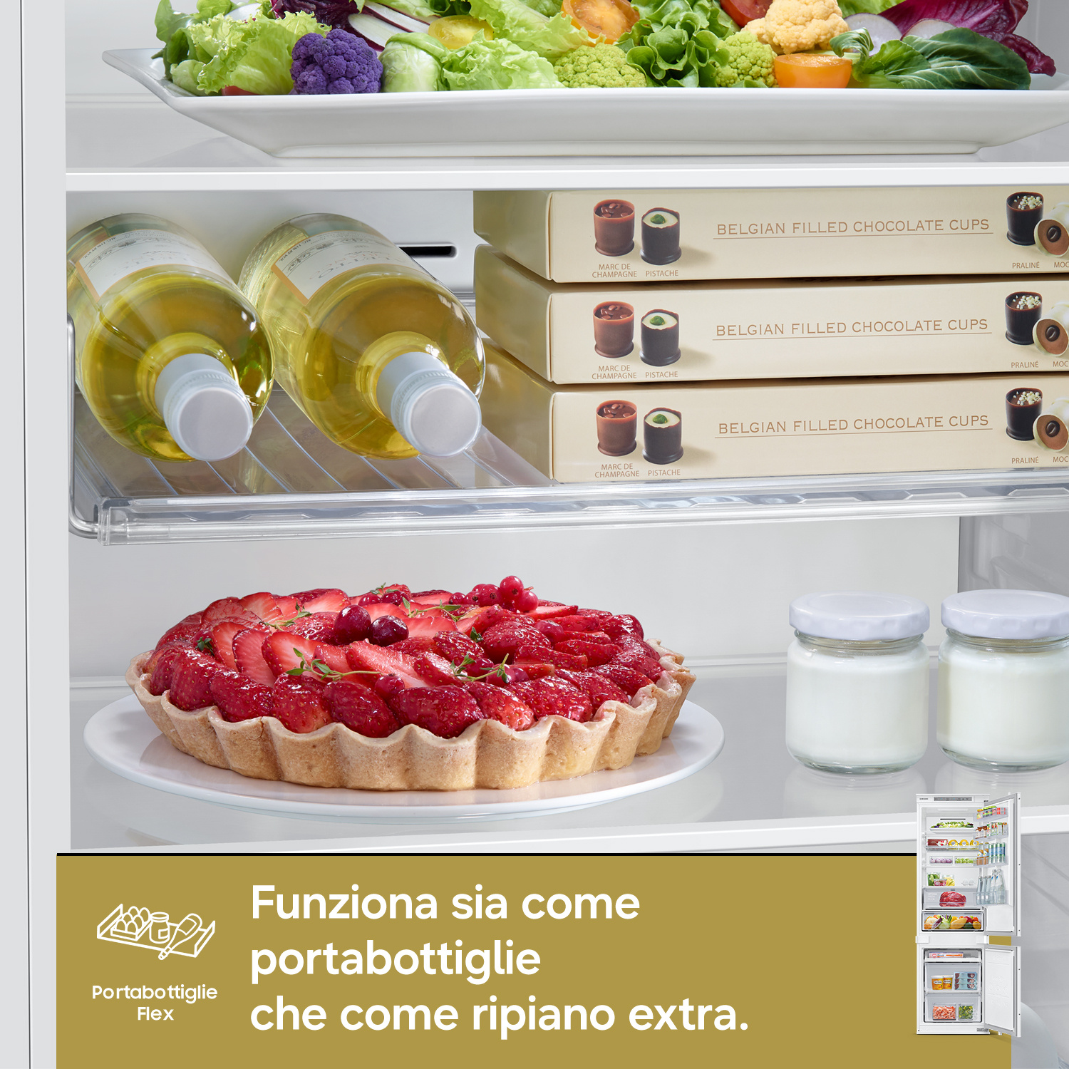 Interno frigorifero con insalata, vino, cioccolatini, torta e yogurt.