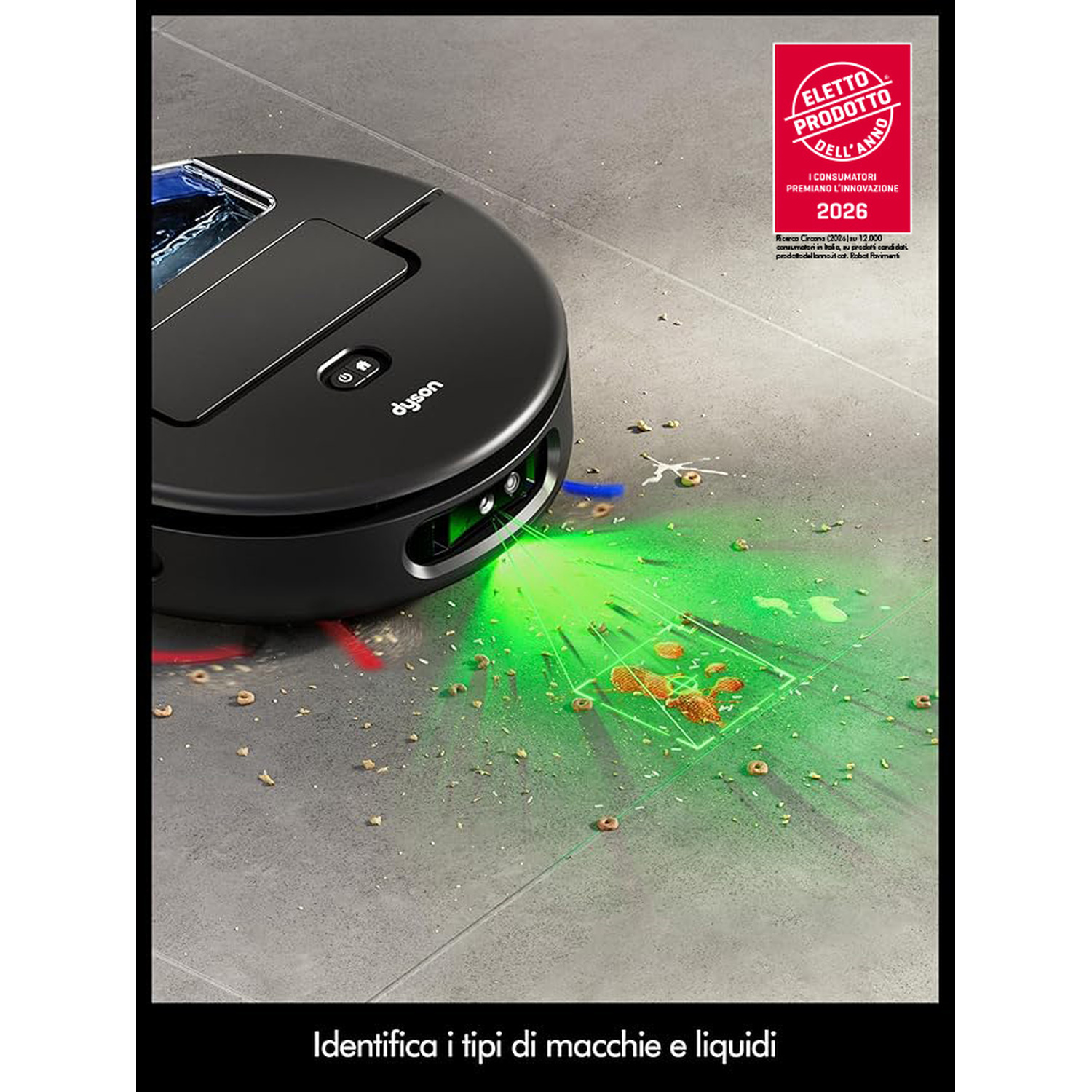 Un robot aspirapolvere Dyson nero pulisce un pavimento piastrellato grigio con briciole e liquidi.