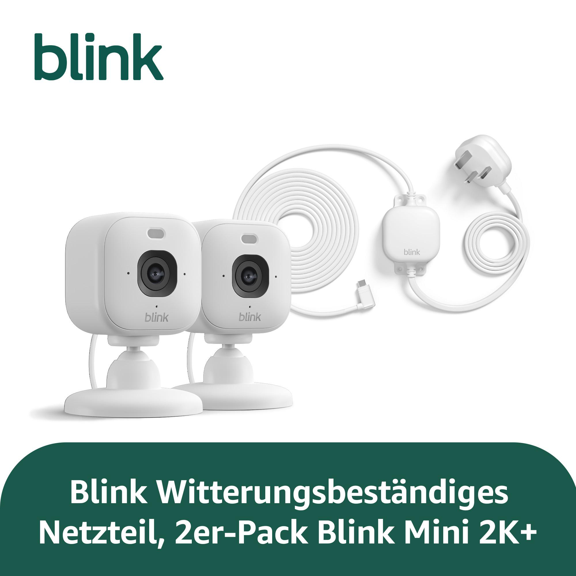 Zwei weiße Blink Mini 2K+ Kameras mit Netzteilen und Kabeln.