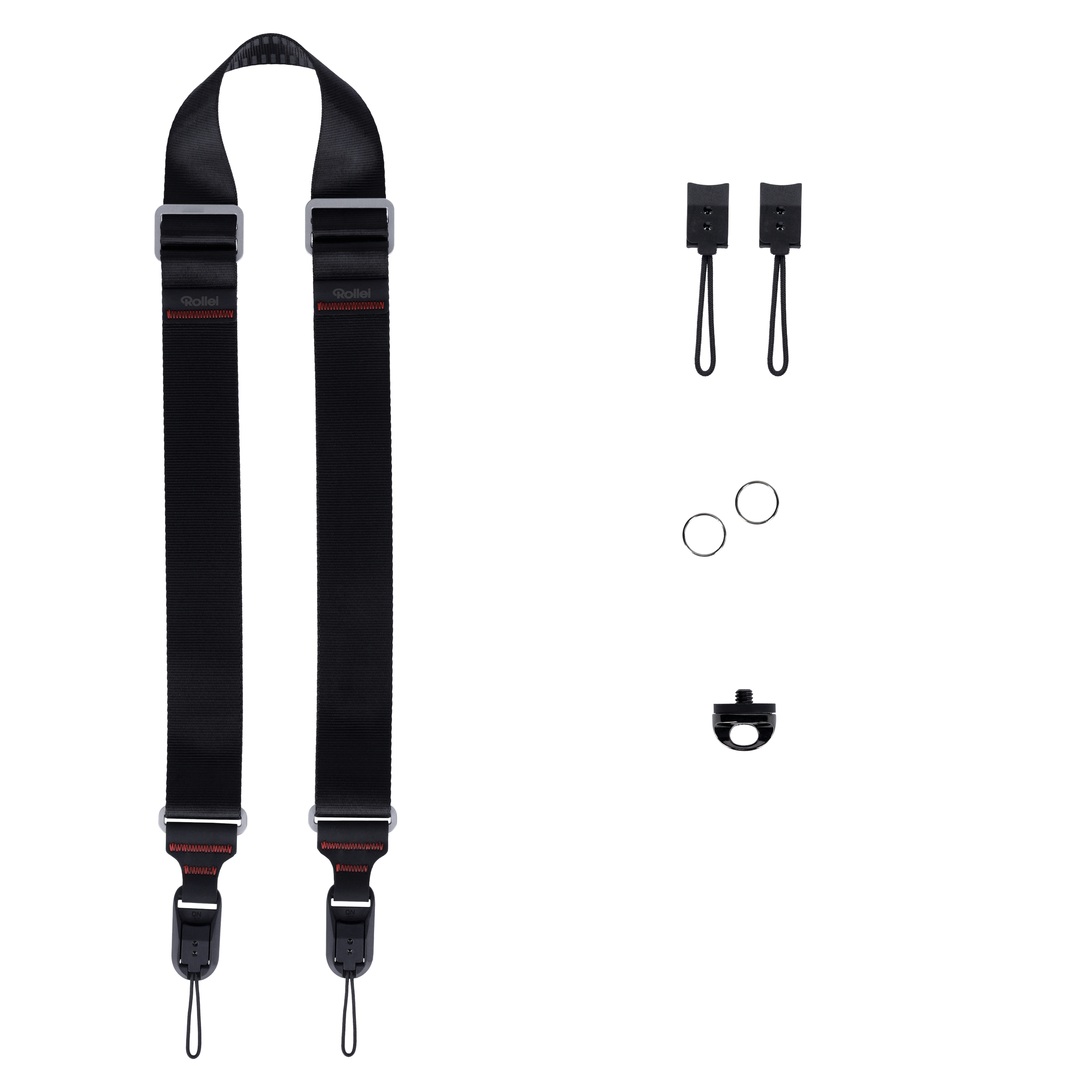 Schwarzes Kameraband mit Zubehör: zwei Befestigungsclips, zwei Ringe, ein Adapter.