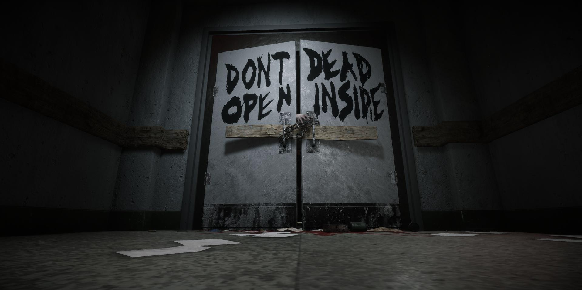 Verriegelte Tür mit "DON'T DEAD OPEN INSIDE"-Aufschrift und einer Kette.
