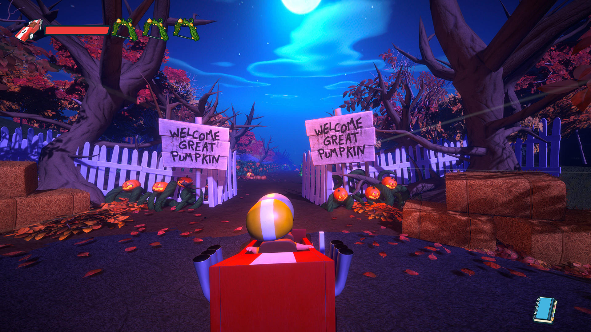 Ein rotes Kart-ähnliches Fahrzeug mit einer gelben Kugel fährt nachts auf eine Halloween-Szenerie zu.