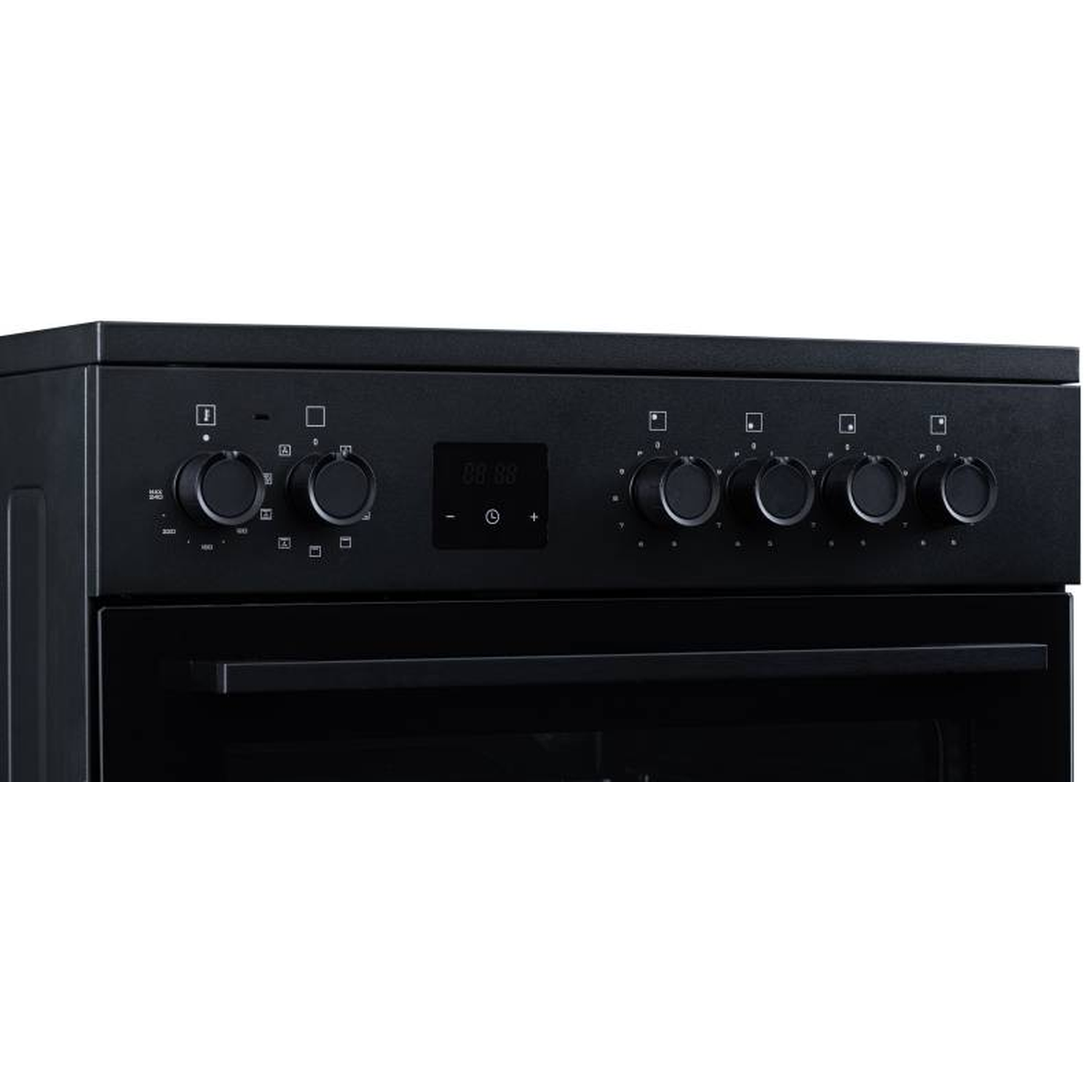 Black oven with control knobs and digital display, close-up view.