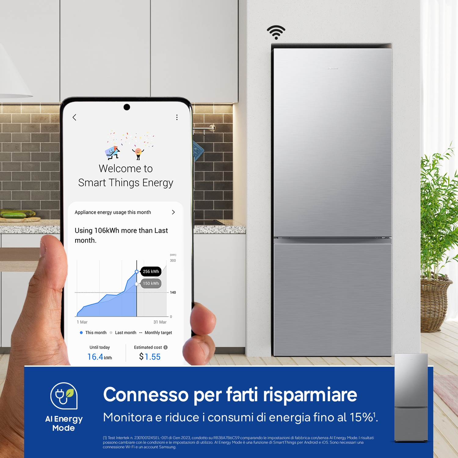 Uno smartphone mostra l'app Smart Things Energy con dati di consumo, accanto a un frigorifero argento.