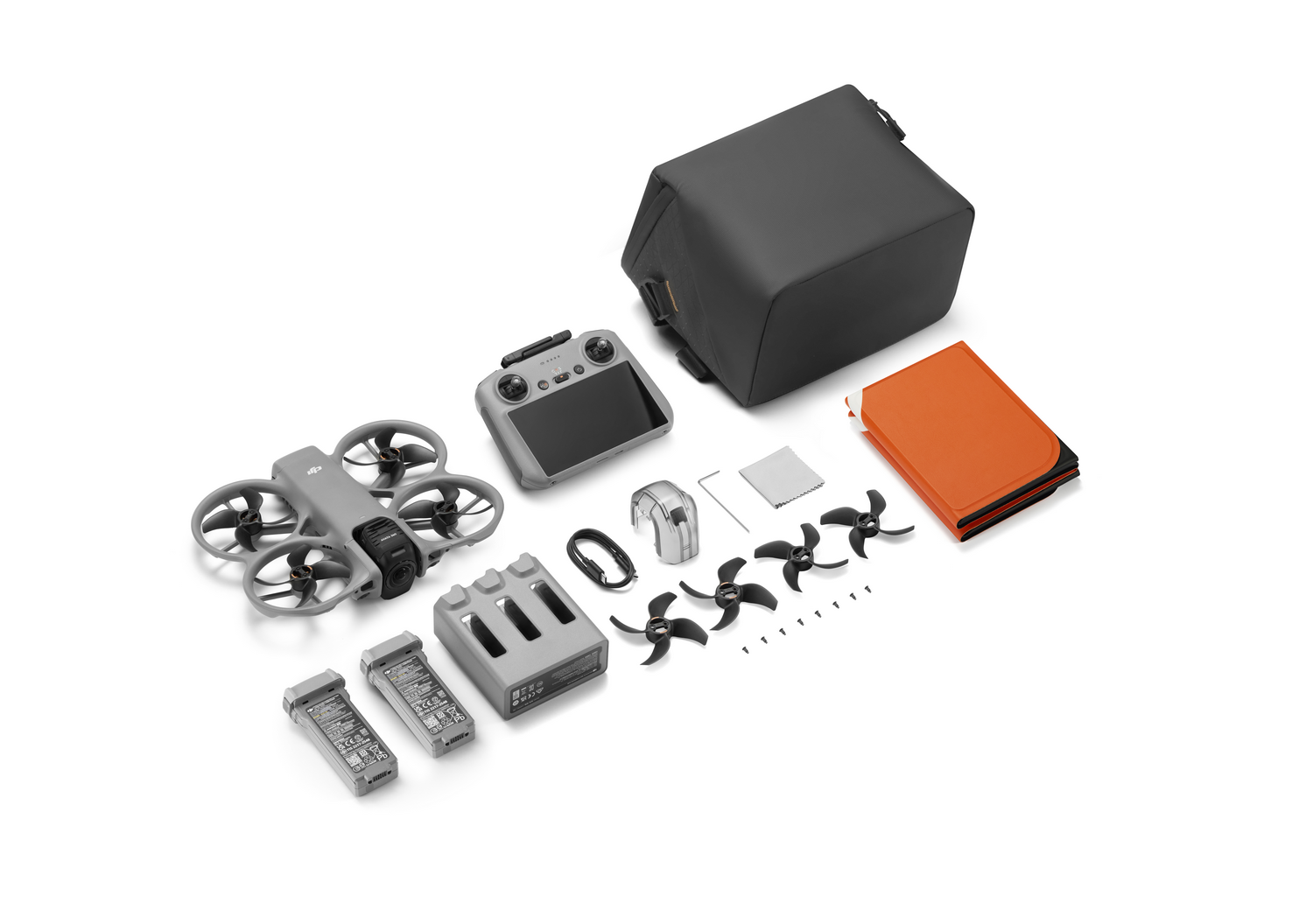Mini dron gris con accesorios: mando, baterías, hélices, bolsa.