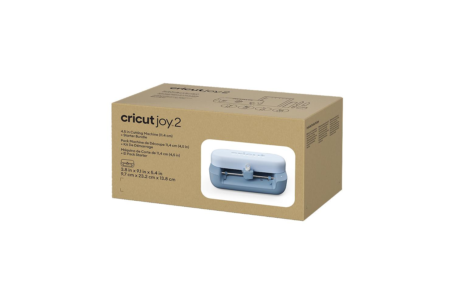 Una caja marrón con un Cricut Joy 2 y una máquina de corte azul.