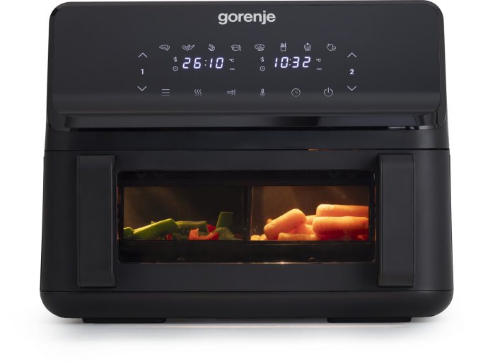 Fekete Gorenje légsütő zöldségekkel benne.
