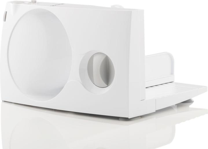 Egy fehér elektromos szeletelő tárcsával és tálcával.