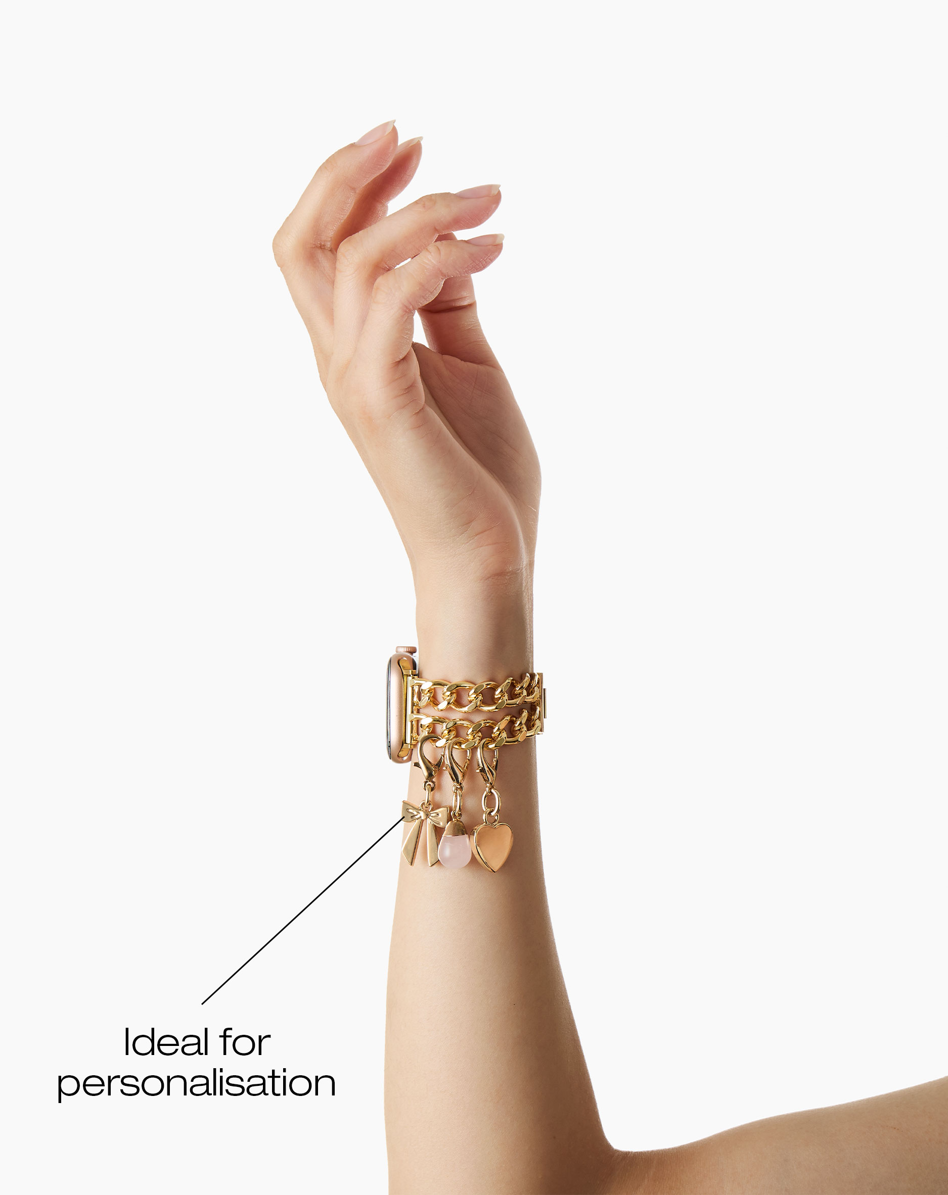 Goldene Apple Watch Armband mit Charms: Schleife, Stein und Herz.