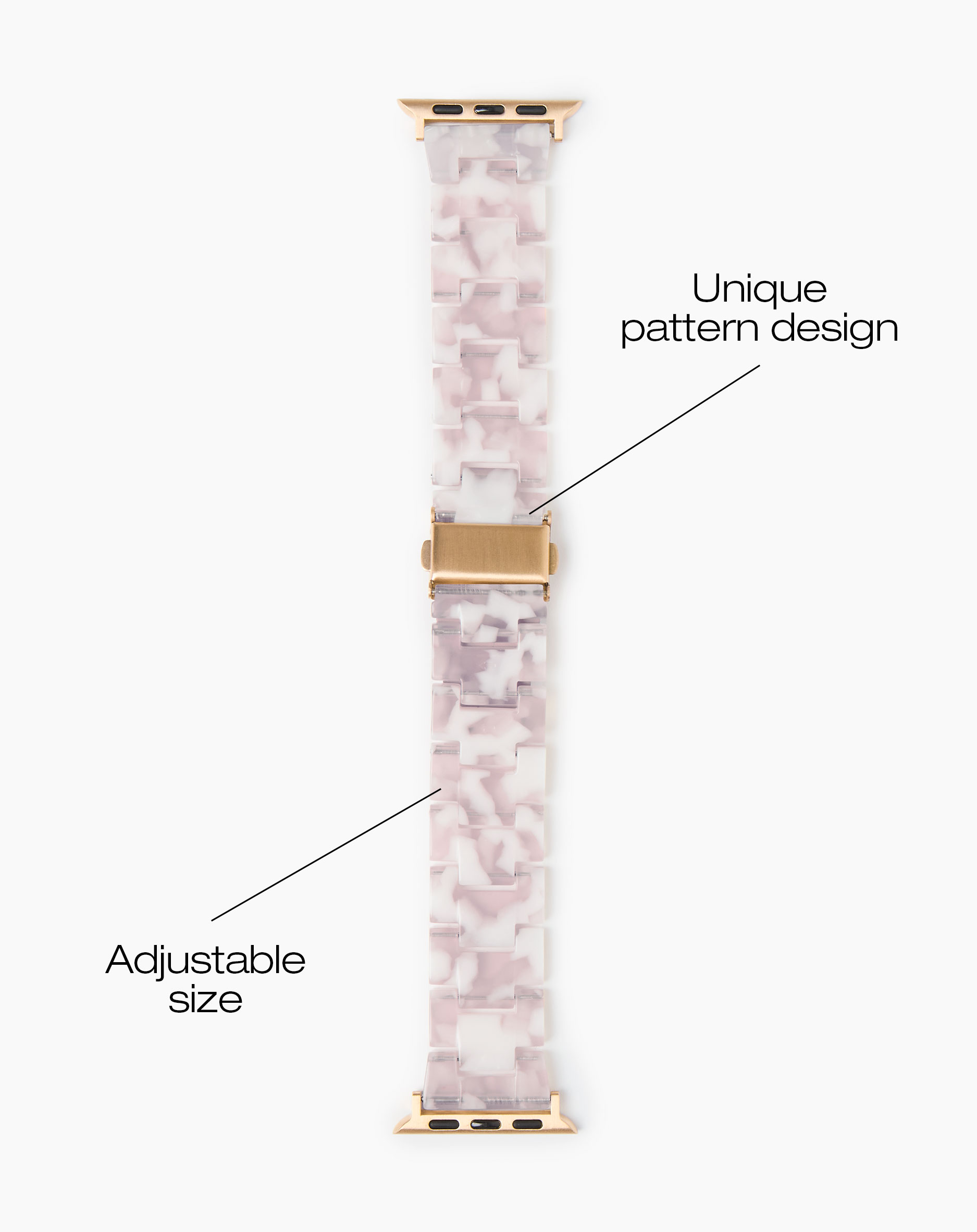 Graues und rosafarbenes Armband mit Marmormuster und goldenem Verschluss.
