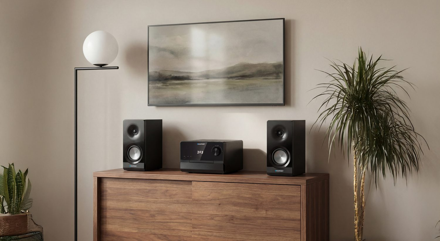 System stereo z dwoma głośnikami na drewnianej szafce.