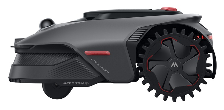 Szara kosiarka automatyczna z dużymi czarnymi kołami, czerwonymi akcentami i kopułą czujnika.