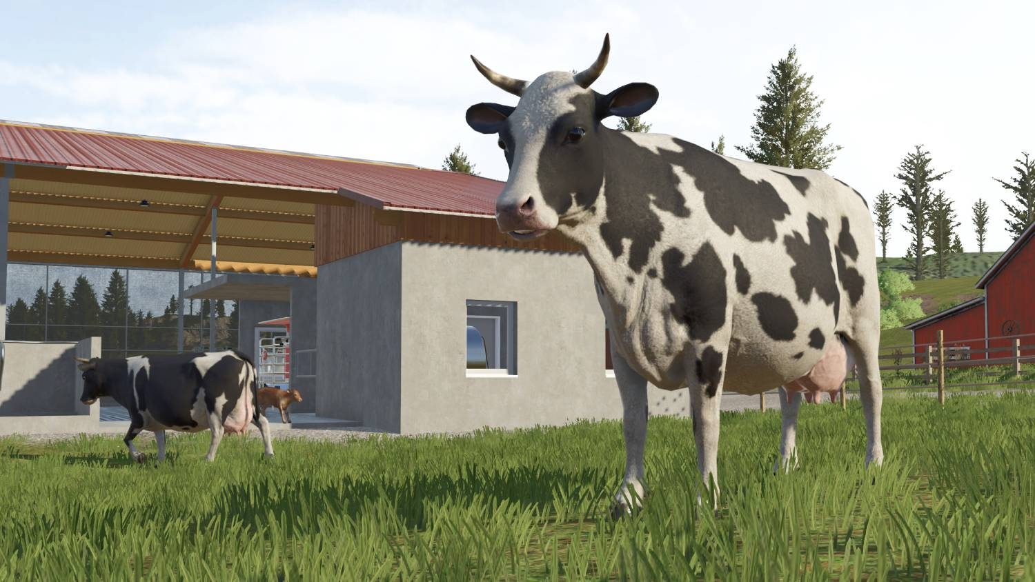 Una vaca blanco y negro está en un campo verde frente a un granero.