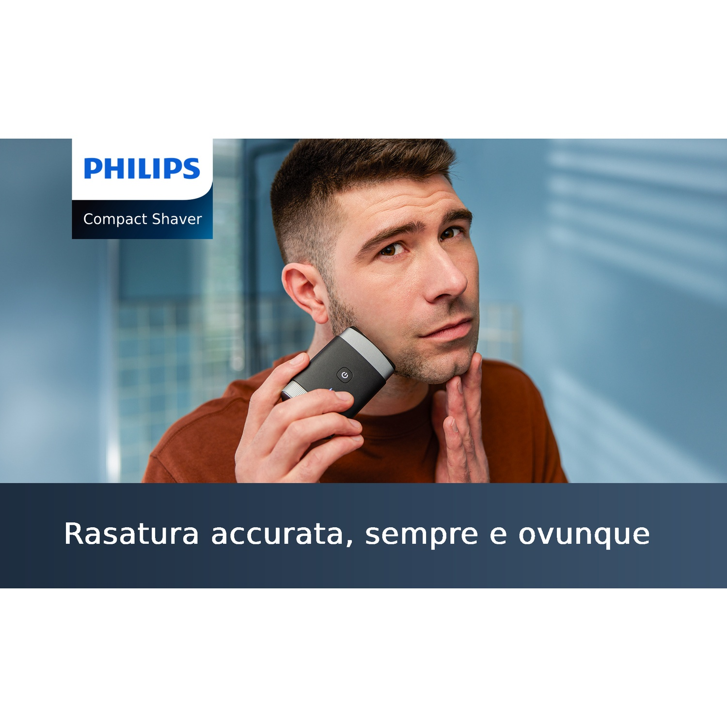 Uomo che si rade con un rasoio compatto Philips.