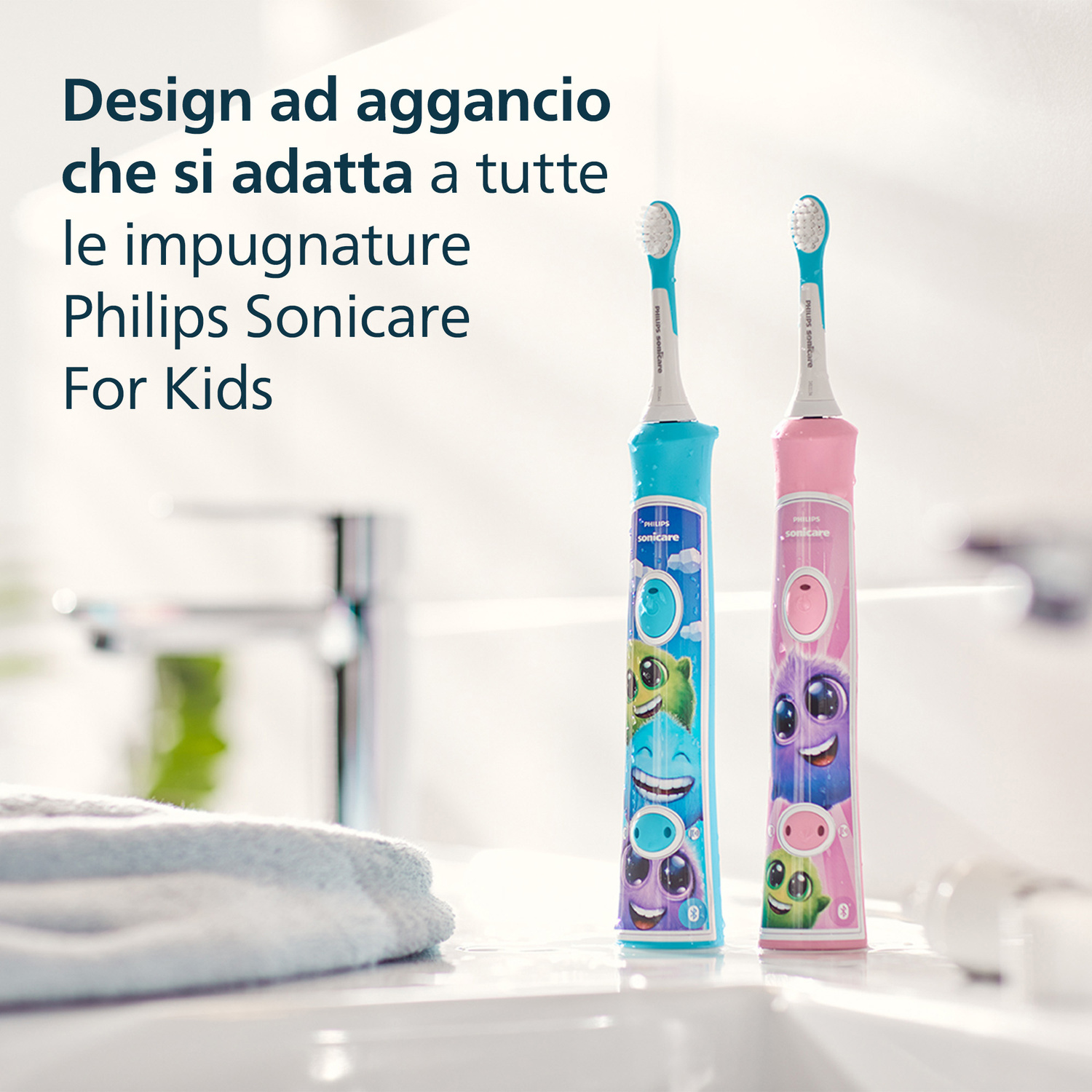 Due spazzolini Philips Sonicare per bambini, blu e rosa, con mostri divertenti.