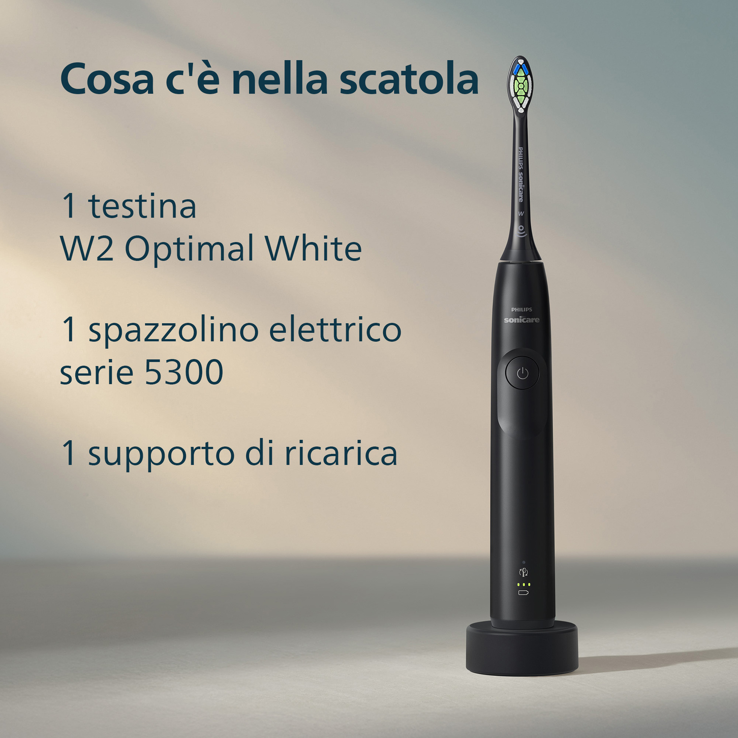 Spazzolino elettrico nero con base di ricarica e testina.