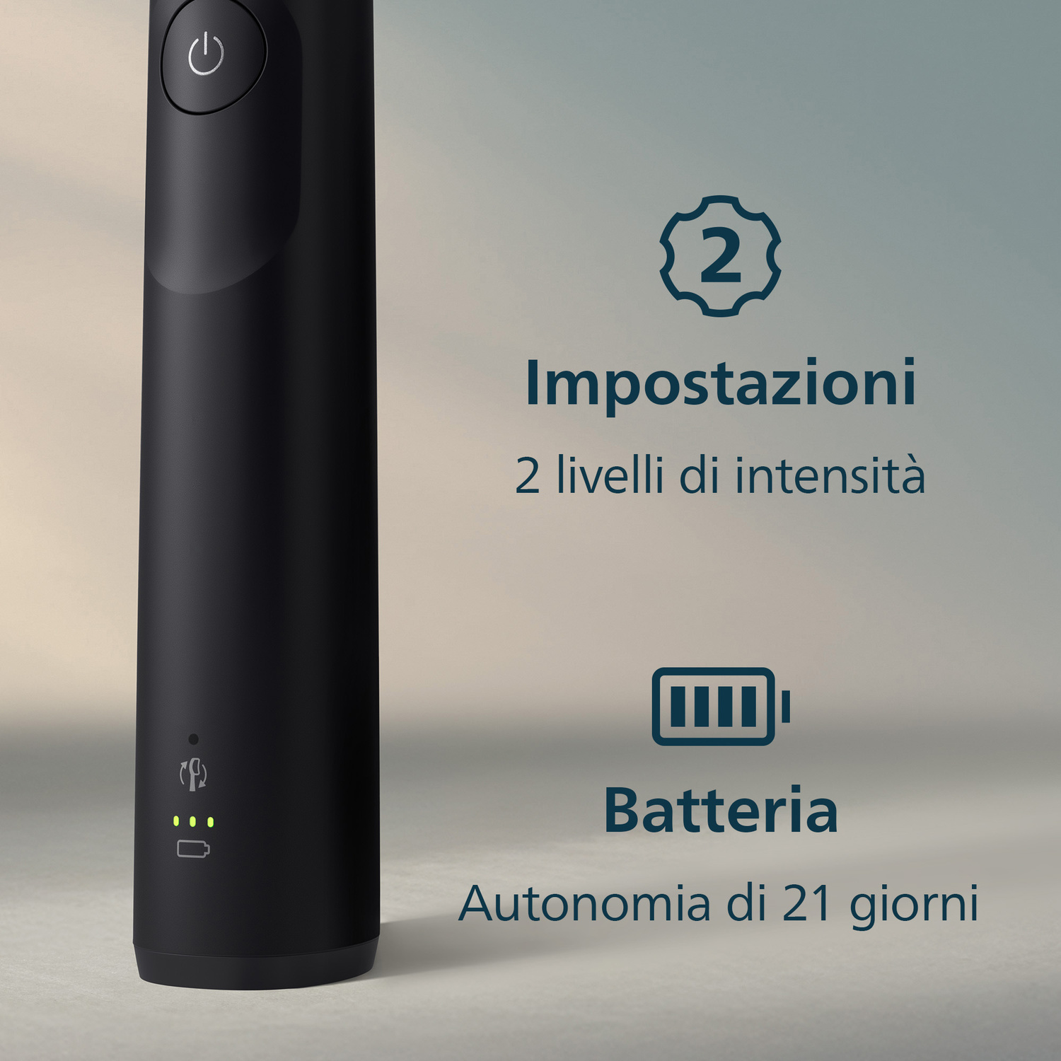 Corpo spazzolino elettrico nero con pulsante accensione e spie stato batteria.