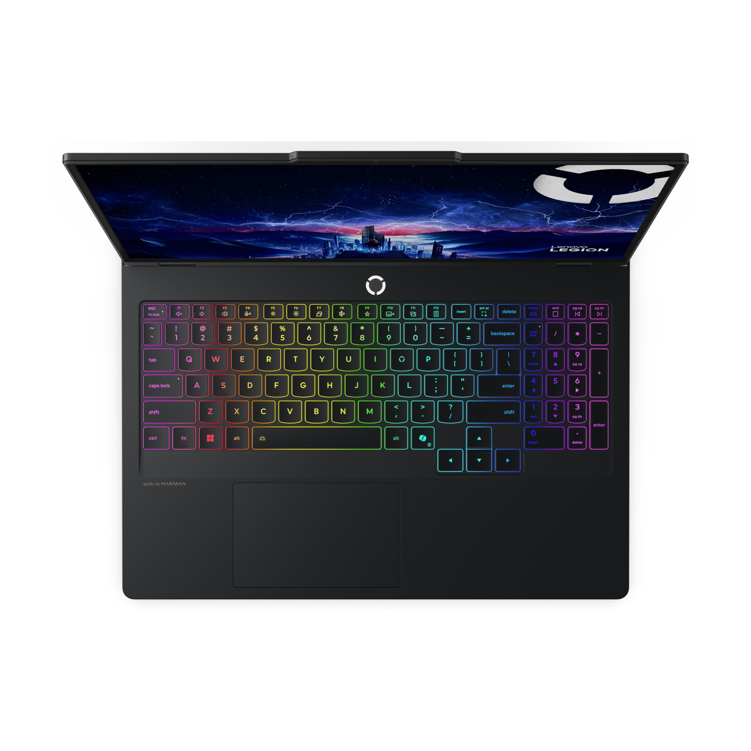 Un laptop nero Lenovo Legion, aperto, mostra uno skyline cittadino notturno sullo schermo. La tastiera ha retroilluminazione arcobaleno.