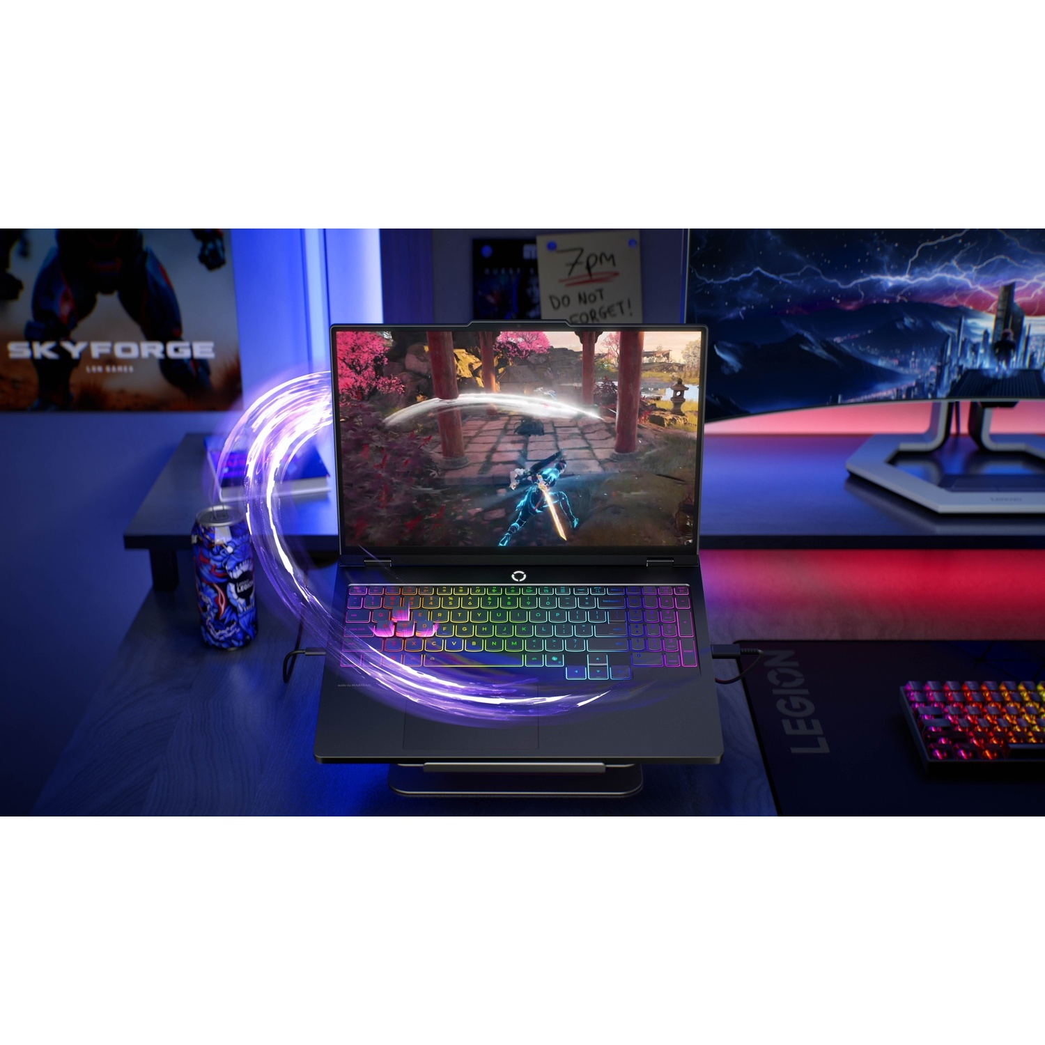 Laptop da gaming con tastiera colorata, gioco animato sullo schermo e accessori.