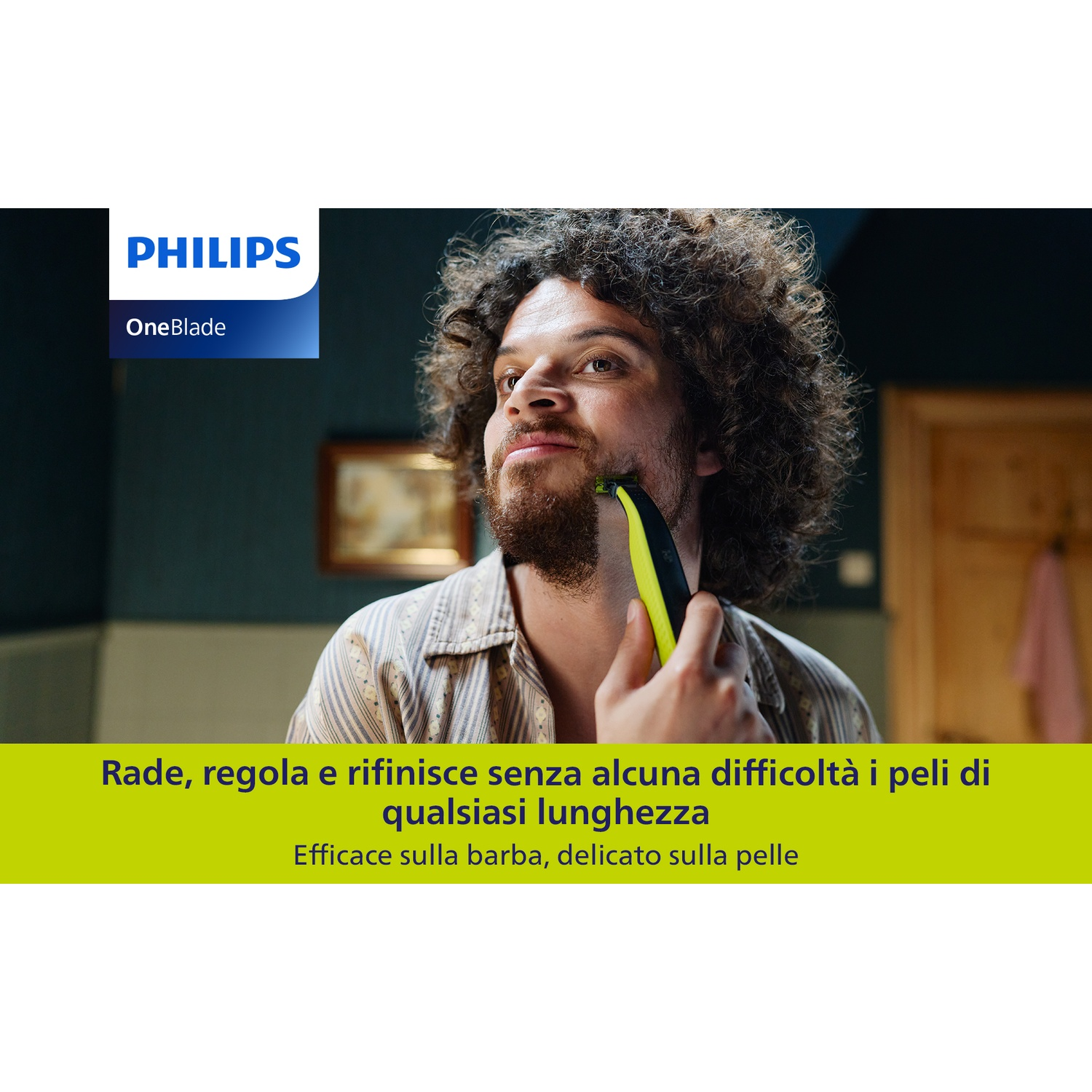 Uomo con capelli ricci si rade con rifinitore Philips OneBlade giallo.