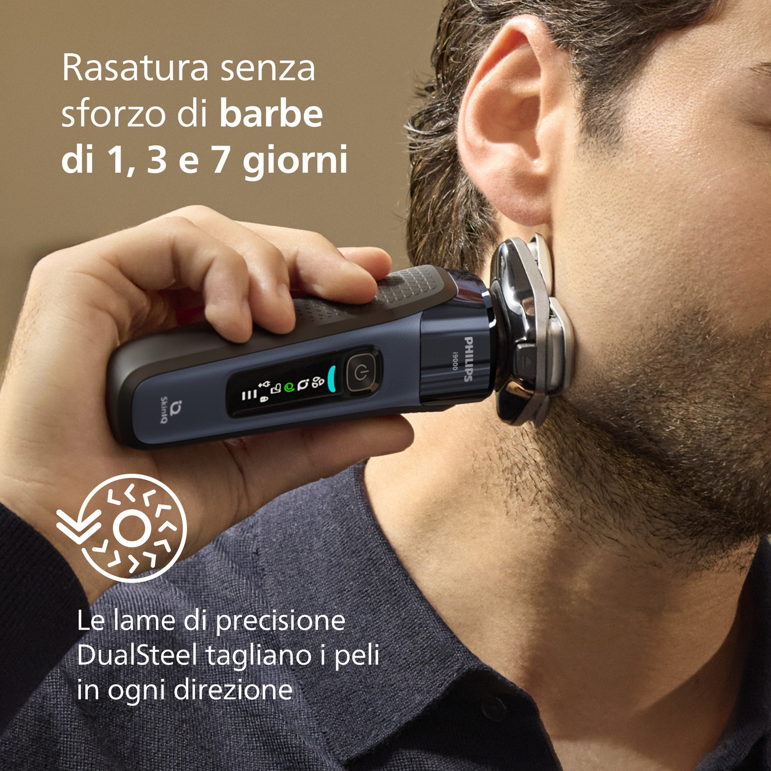 Uomo si rade con rasoio Philips. Lame di precisione tagliano peli.