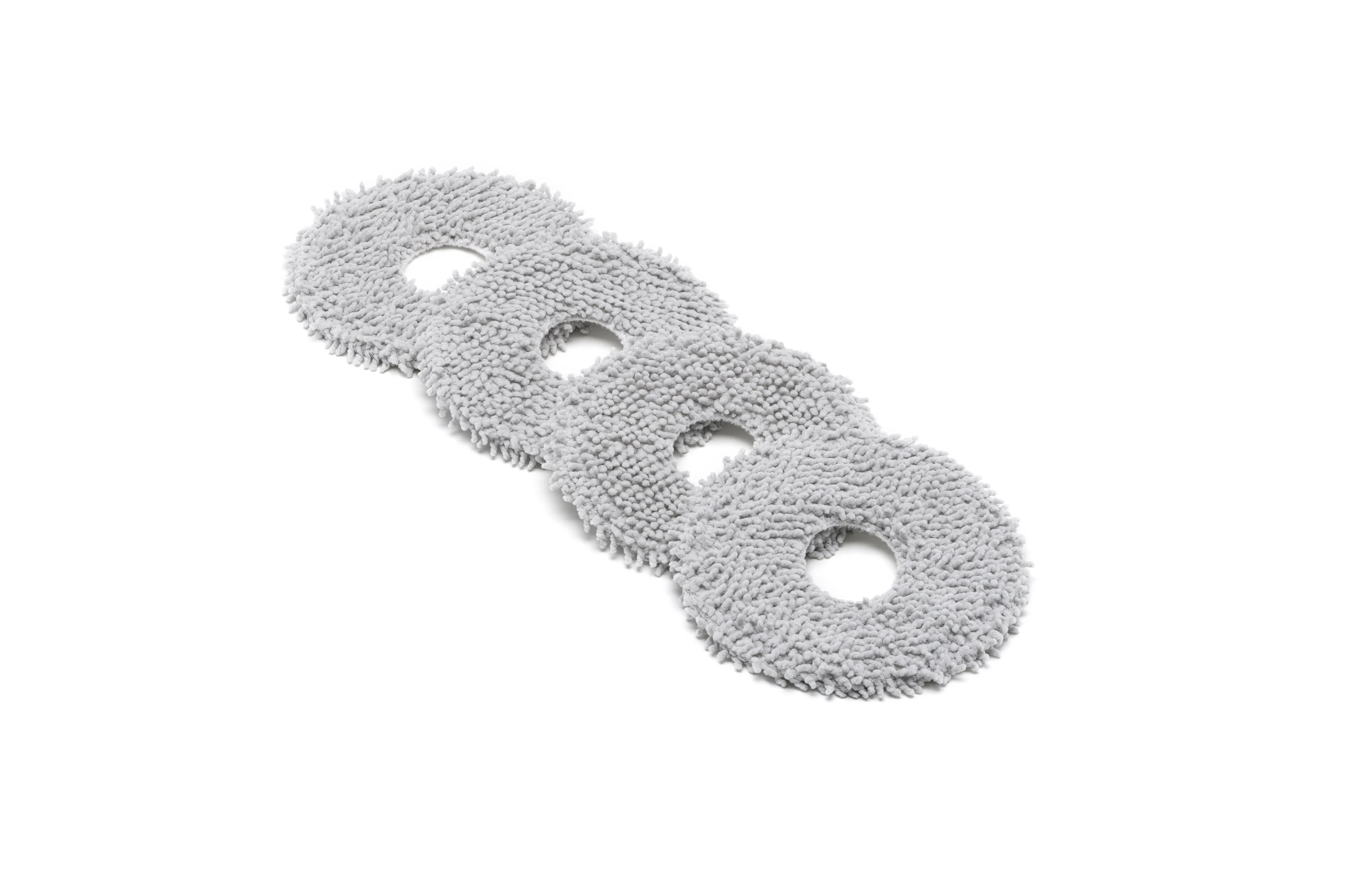 Ortasında delik bulunan üç yuvarlak, gri mikrofiber paspas bezi yan yana.