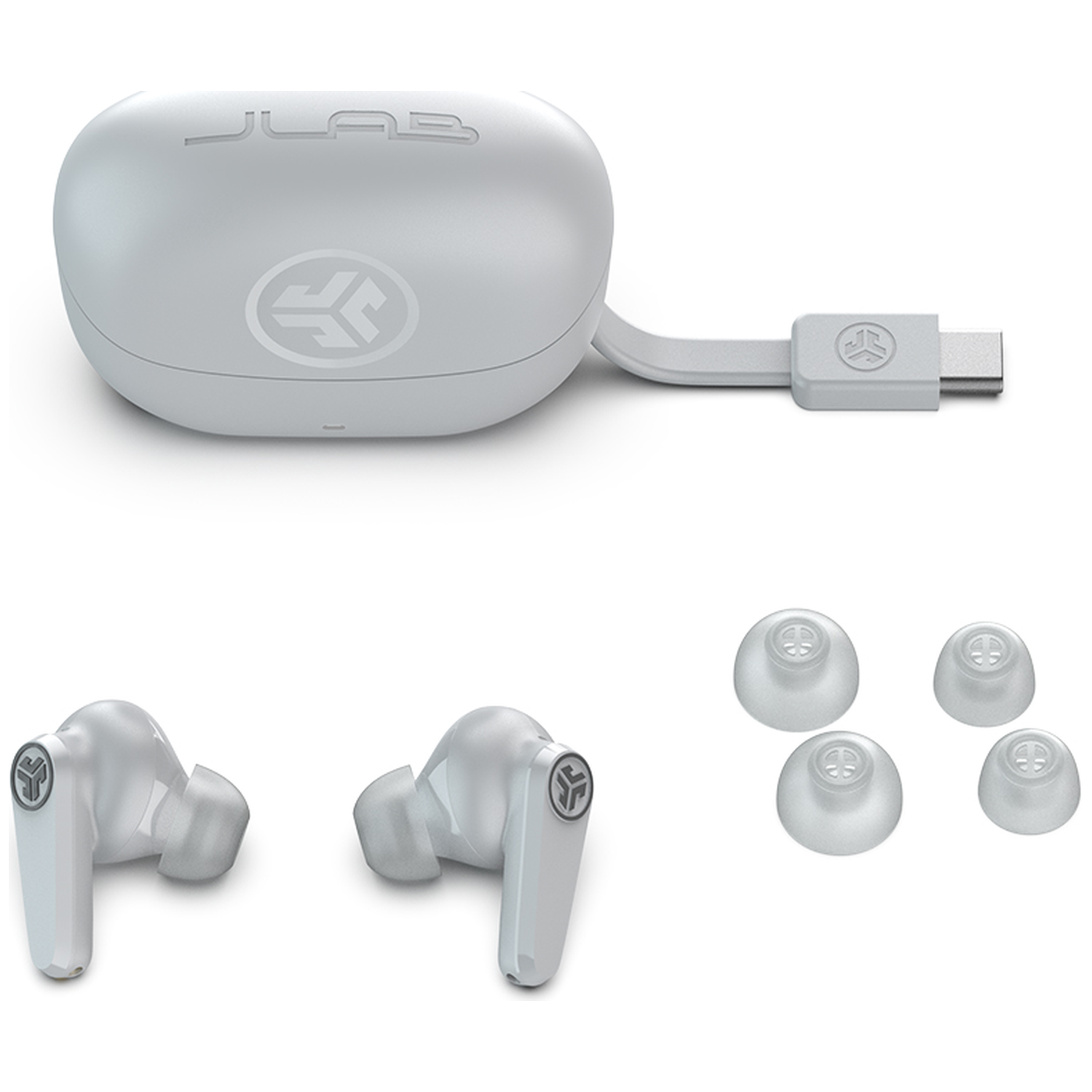 White JLab earbuds with charging case and replacement tips.