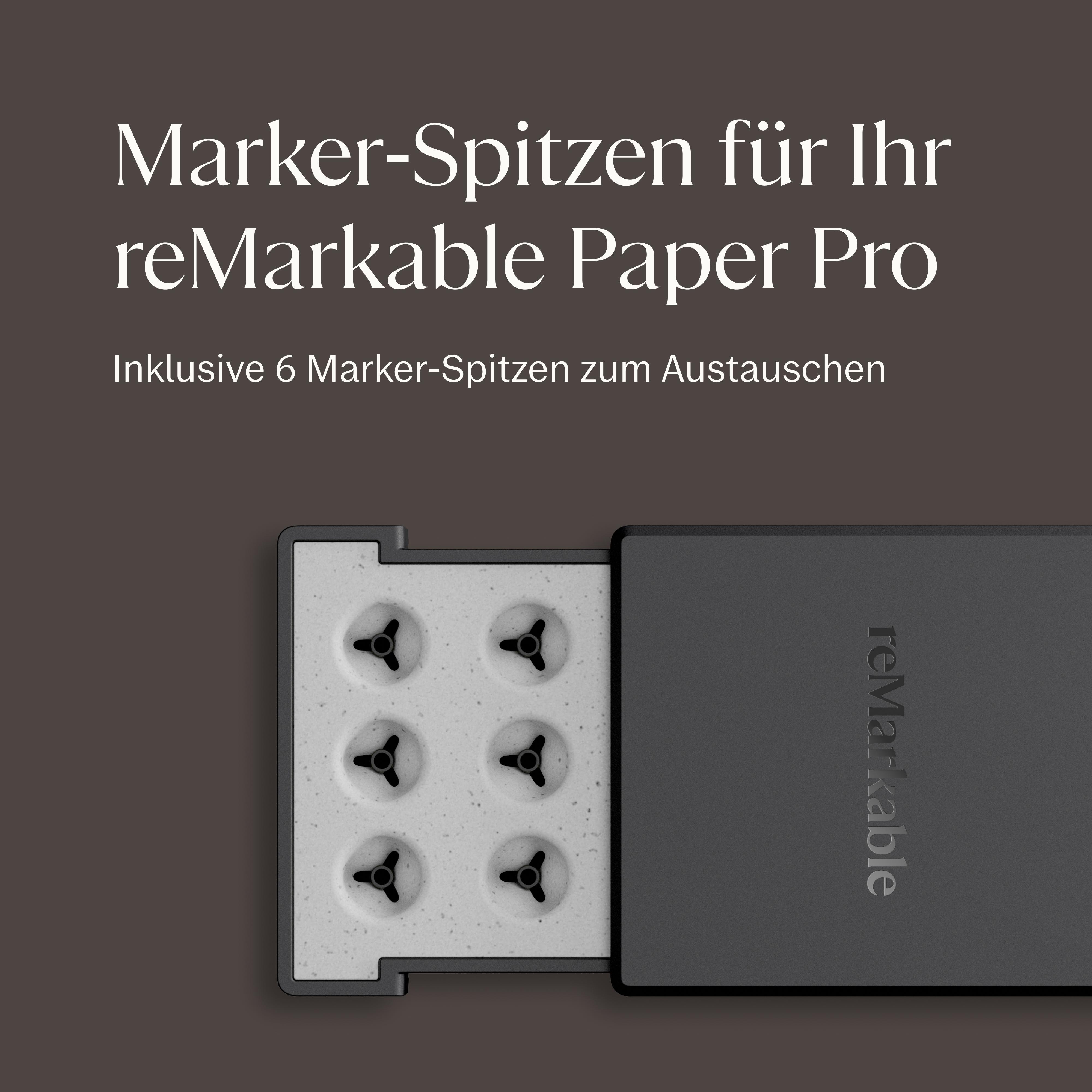 Sechs Marker-Spitzen in einer Halterung neben einer grauen reMarkable-Box.