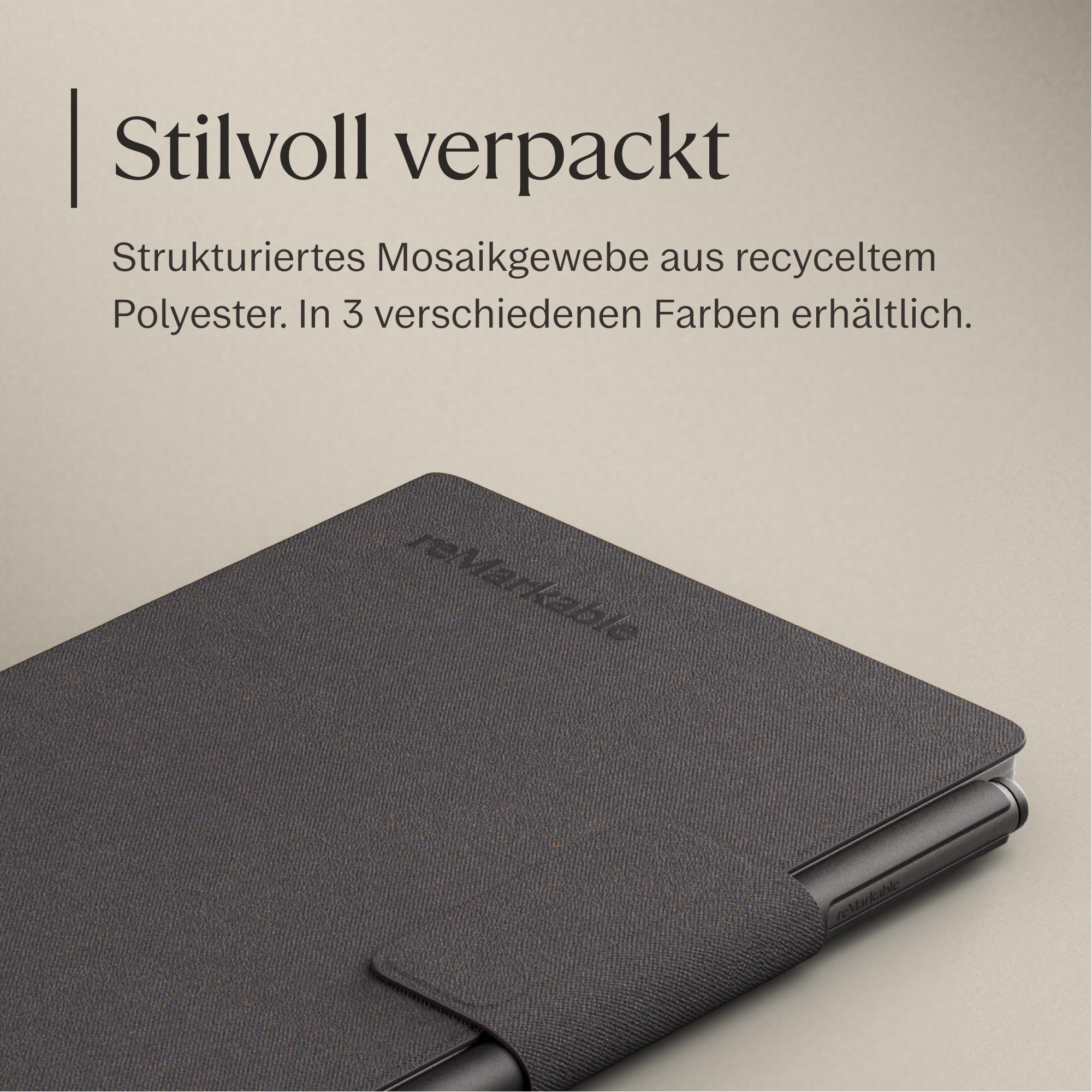 Graues Notizbuch mit Stift auf einem hellen Hintergrund.