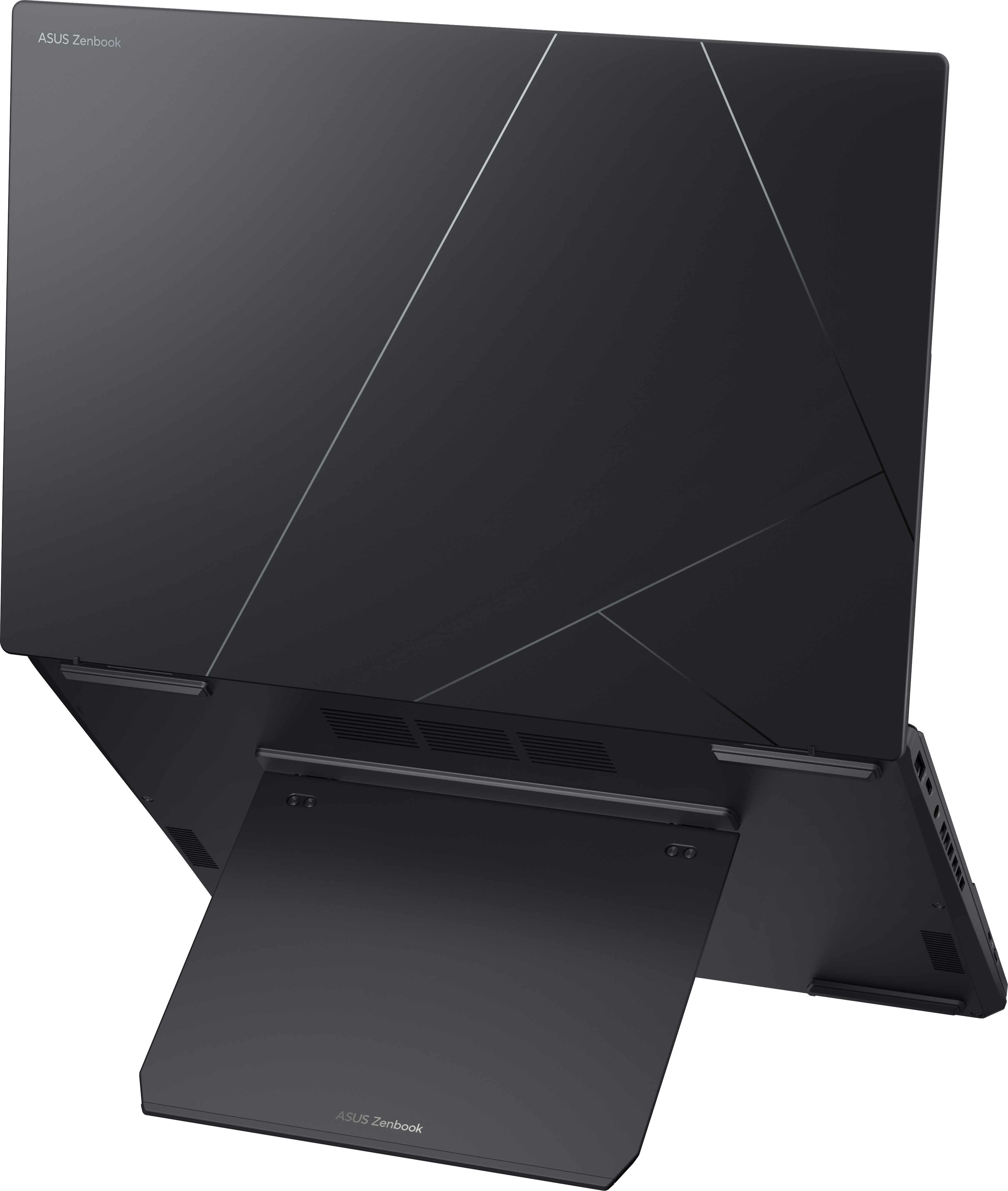 Ein geschlossener, dunkelgrauer Asus Zenbook Laptop mit geometrischen Linien.
