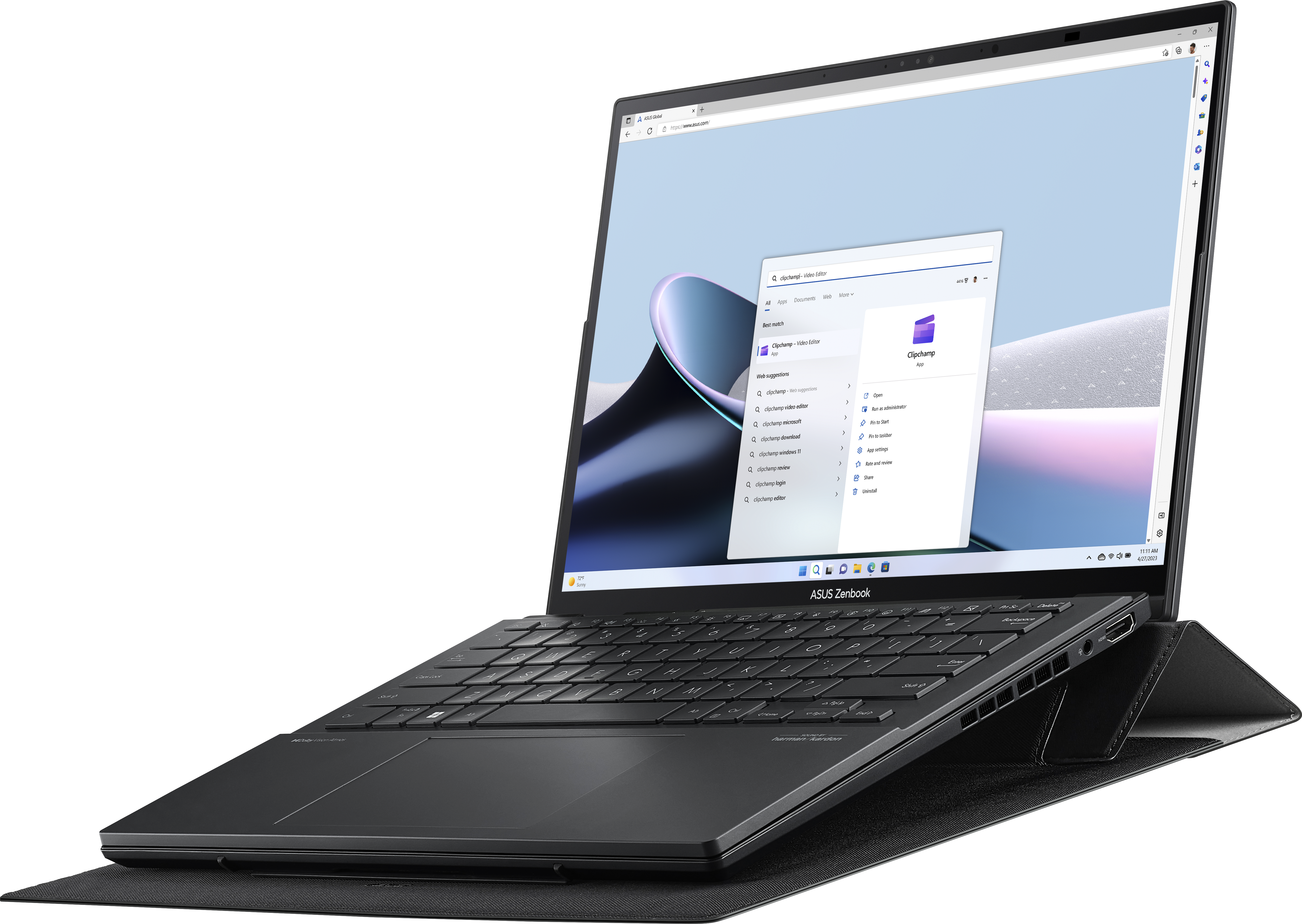 Schwarzer ASUS Zenbook Laptop auf einer schwarzen Unterlage, geöffnet mit einem Fenster auf dem Bildschirm.