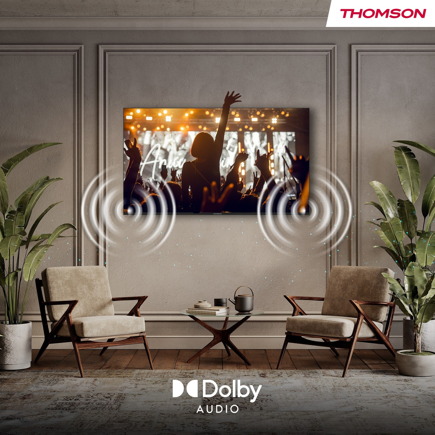 Un soggiorno con TV Thomson che mostra un concerto.