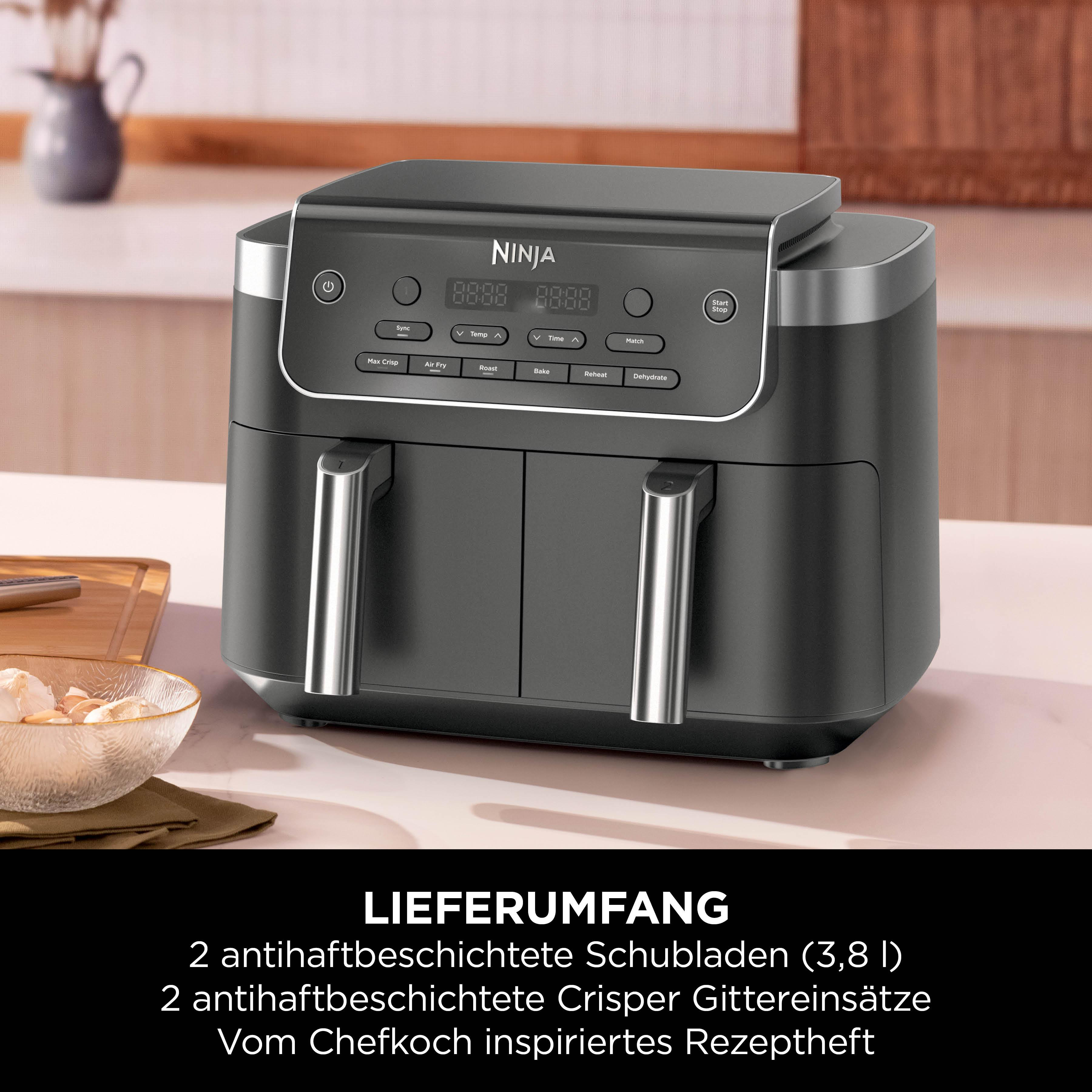 Ein schwarzer Ninja Doppel-Heißluftfritteuse mit digitalen Bedienelementen steht auf einer Arbeitsplatte.