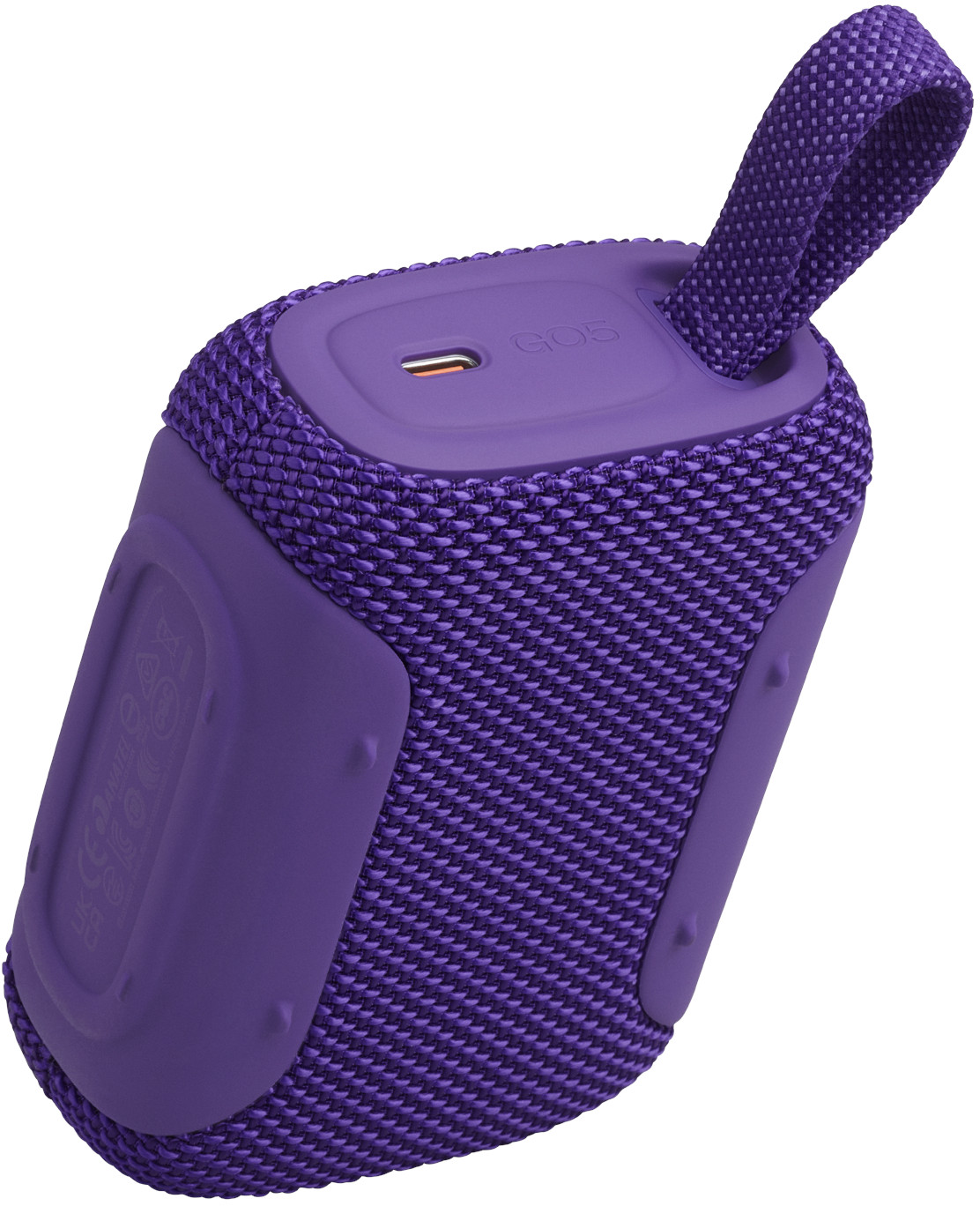 Altoparlante portatile viola con copertina in tessuto e manico. Porta USB-C visibile.