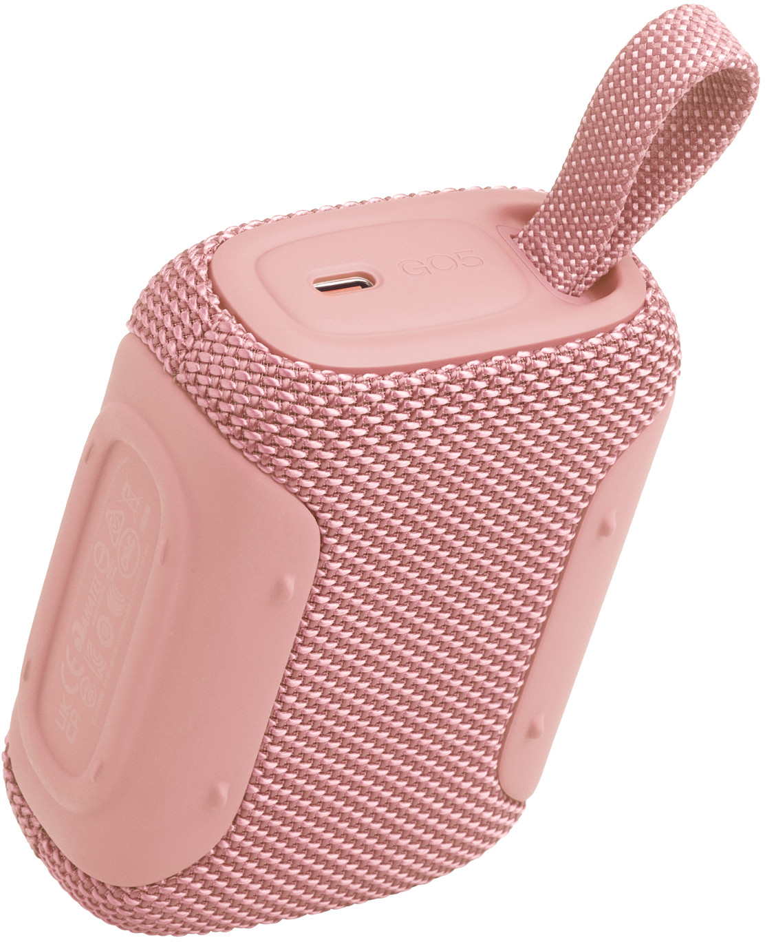 Un piccolo altoparlante Bluetooth rosa con copertura in tessuto e un laccio.