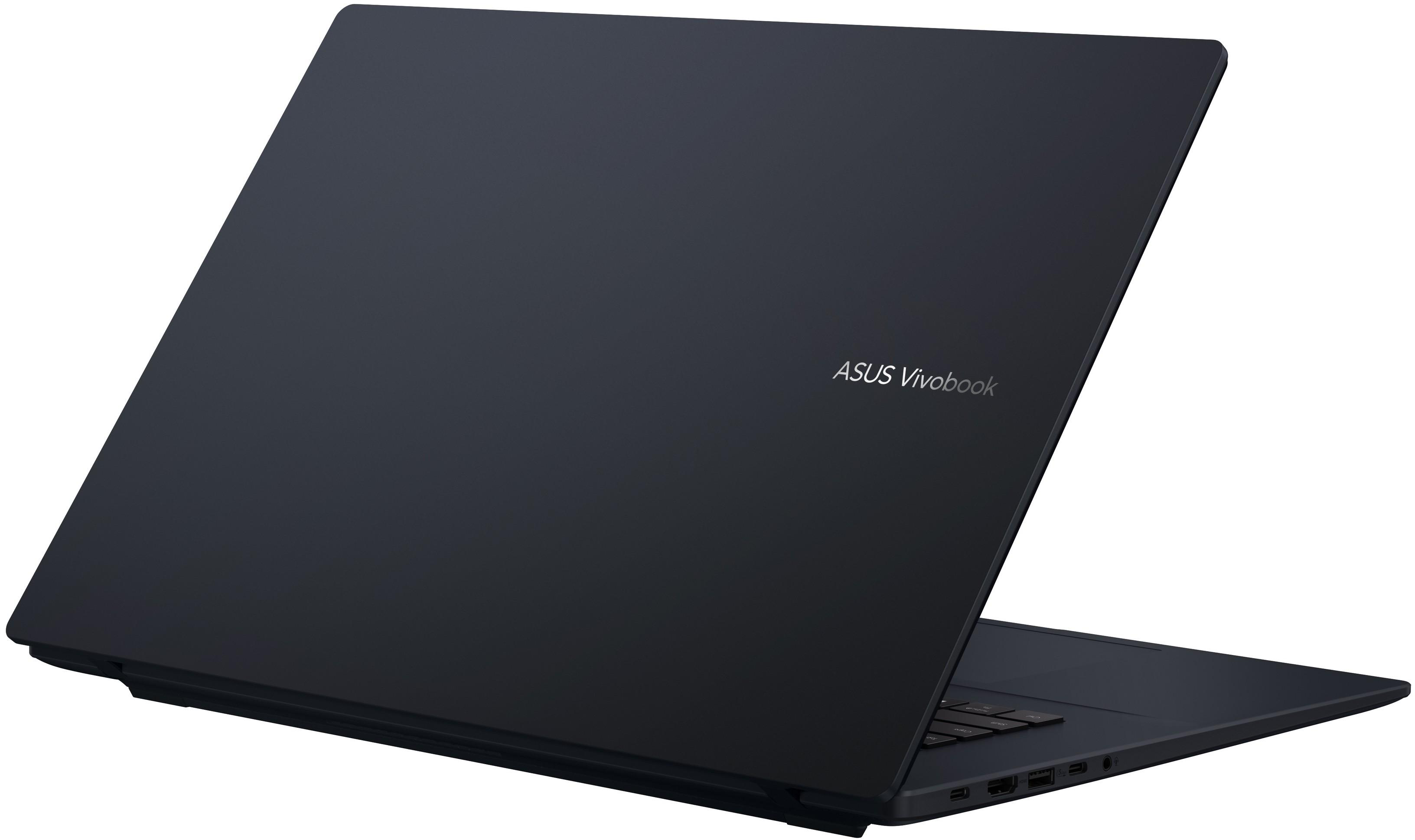Egy sötét ASUS Vivobook laptop nyitott képernyővel, látható billentyűzettel és portokkal.